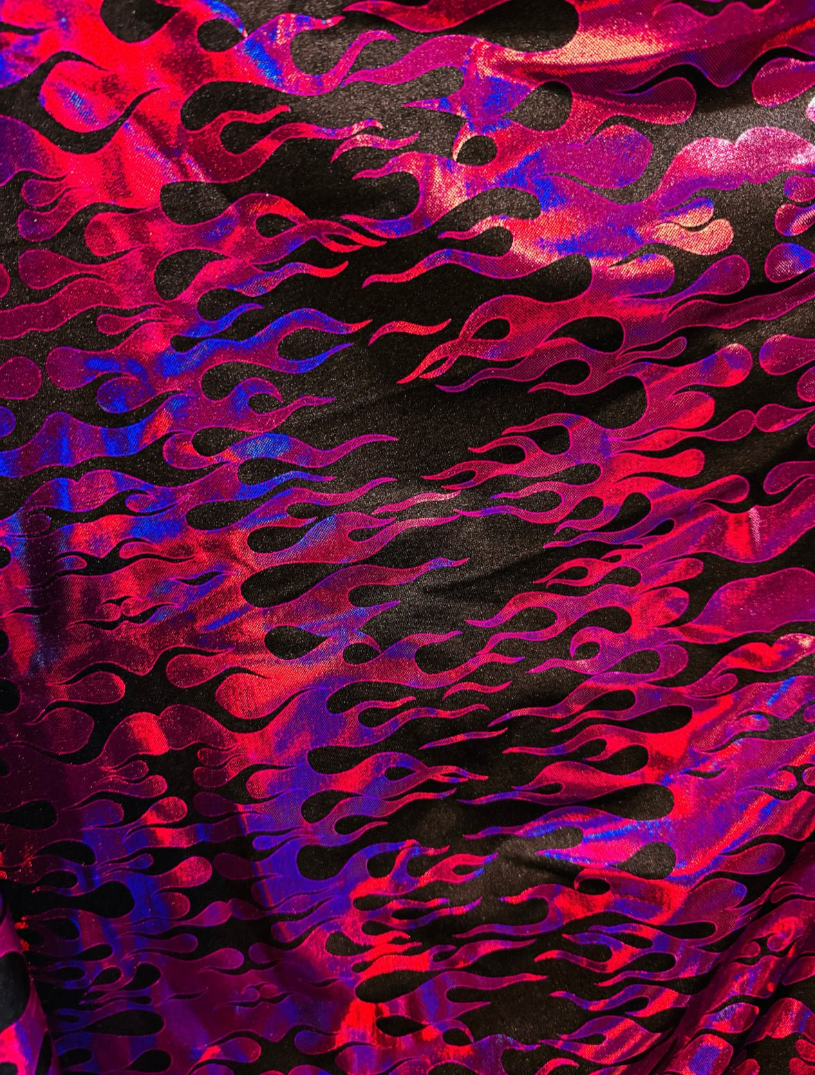 New flames pattern design hologram metallic nylon spandex 4-way stretch 58/60”Sold by the YD. Ships from Los Angeles California USA.