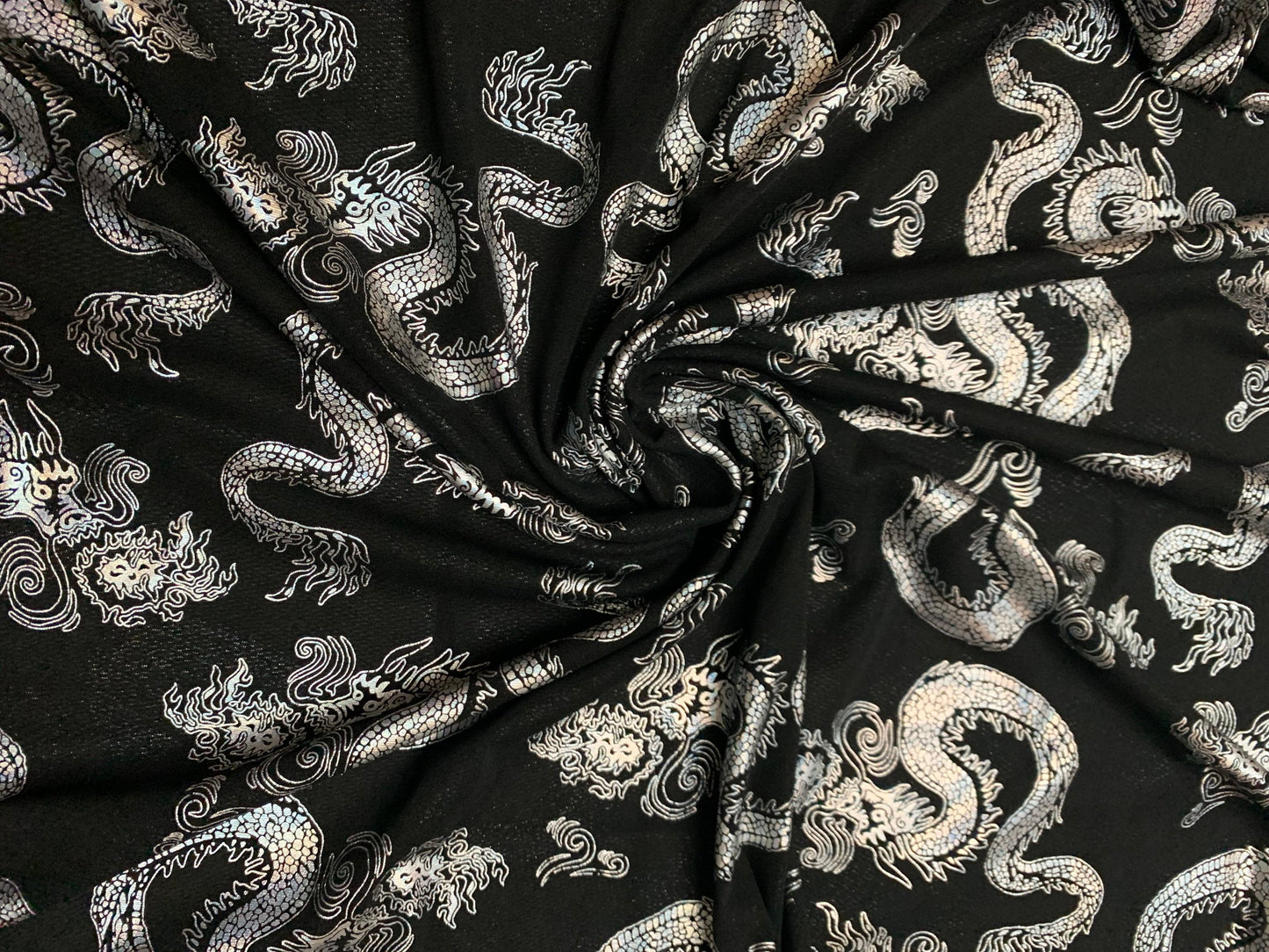 Dragon design iridescent silver power mesh nylon spandex 4-way stretch 58/60”sold by the YD.ships worldwide from Los Angeles California USA