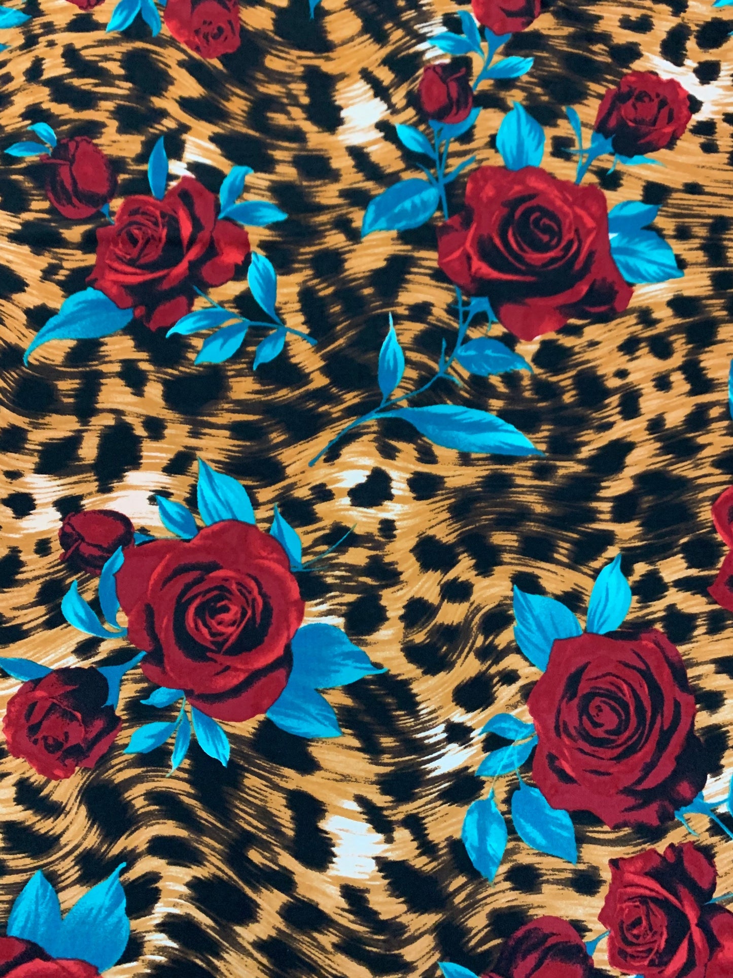 Red roses on leopard design print on nylon spandex 4-way stretch 58/60”sold by the YD. ships Worldwide from Los Angeles California USA