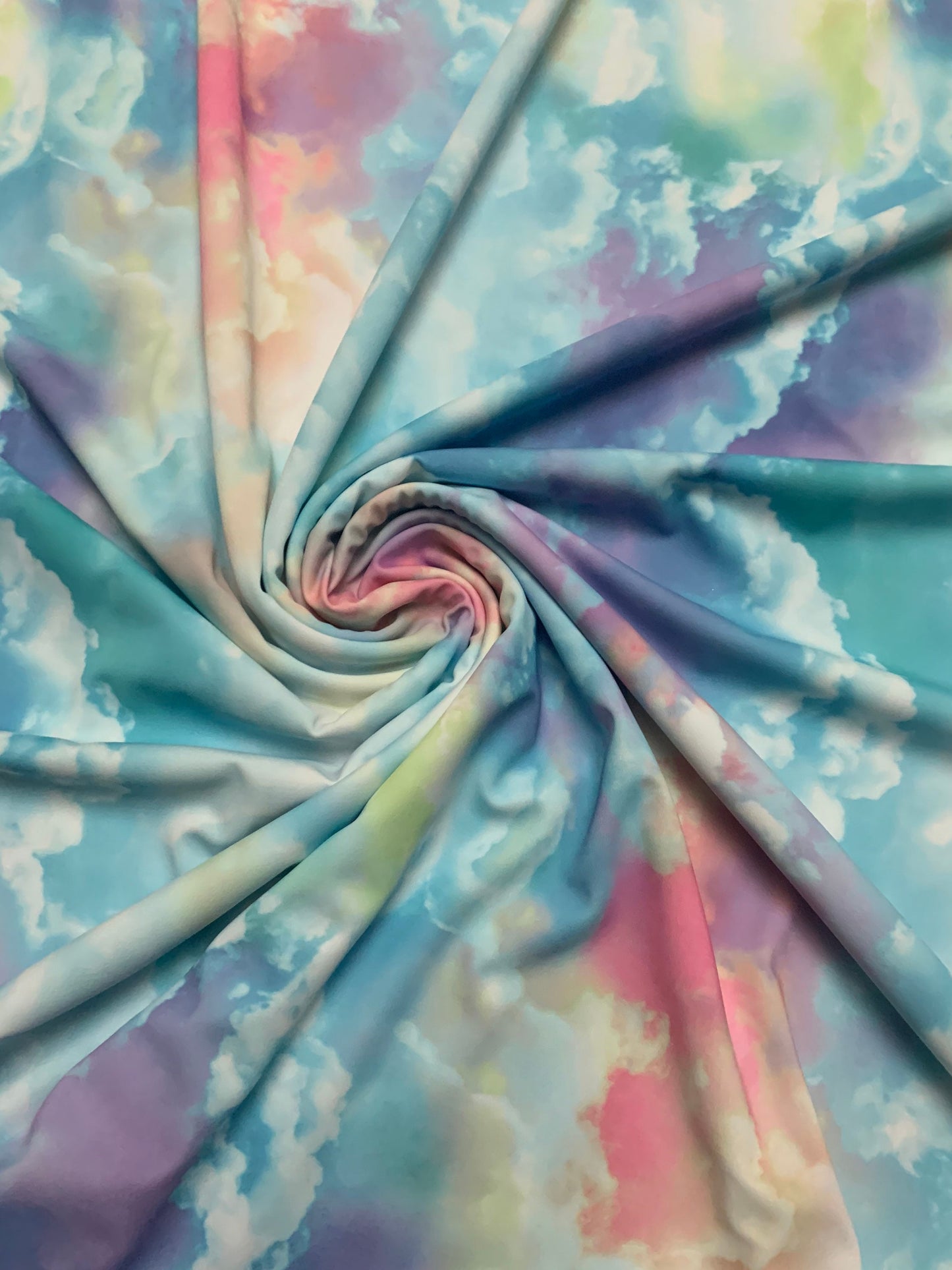Sky cloud multicolor design print on great quality nylon spandex 4-way stretch 58/60”sold by the DY. Ships Worldwide from Los Angeles CA.