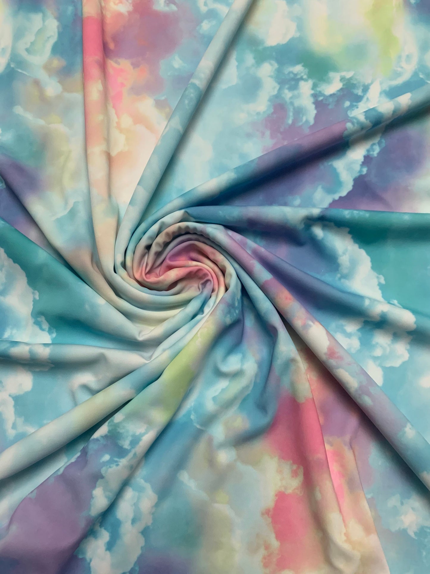 Sky cloud multicolor design print on great quality nylon spandex 4-way stretch 58/60”sold by the DY. Ships Worldwide from Los Angeles CA.