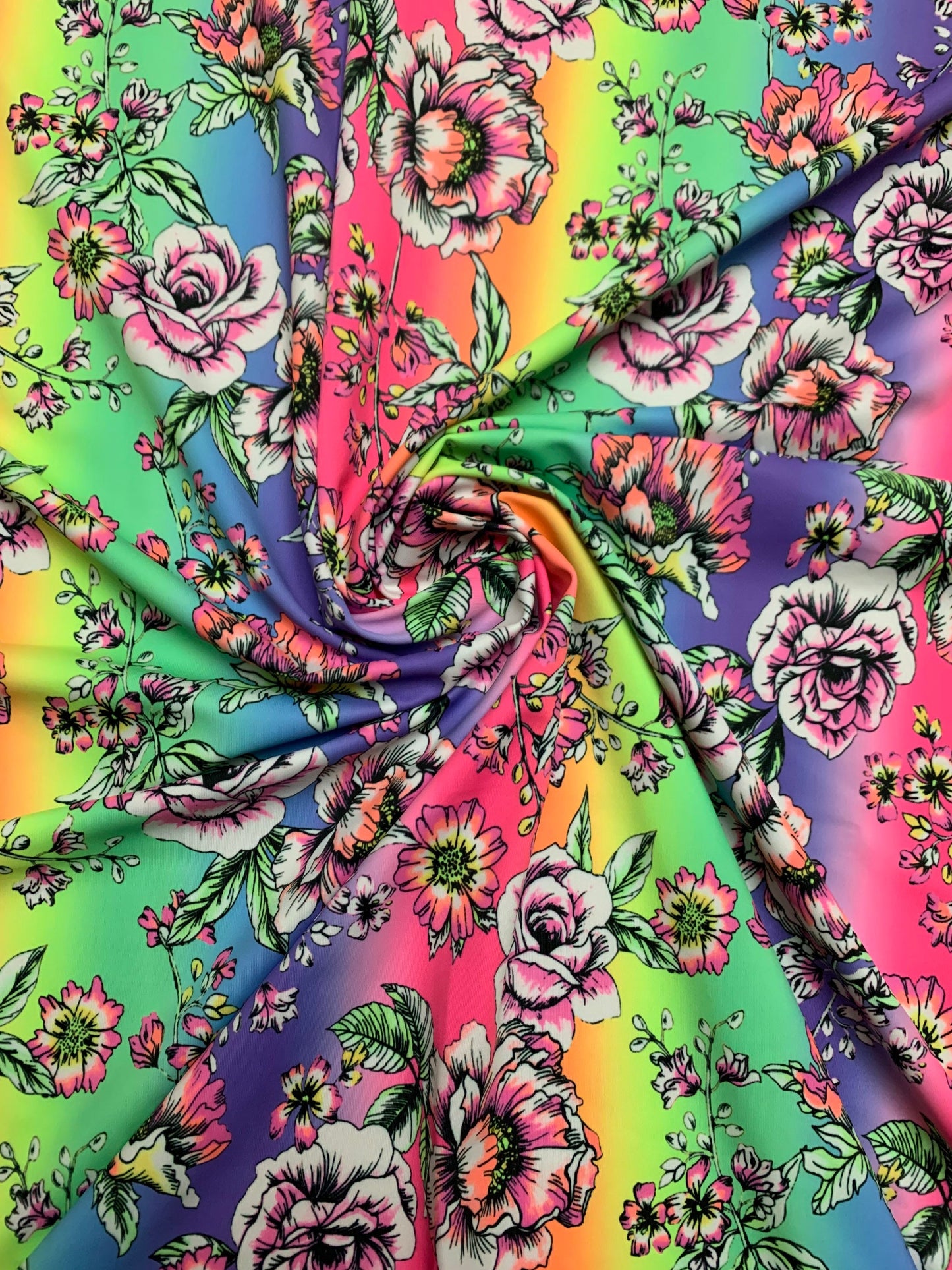 Rainbow and roses design print on the best quality nylon spandex 4-way stretch 58/60”sold by the DY. Ships Worldwide from Los Angeles CA.