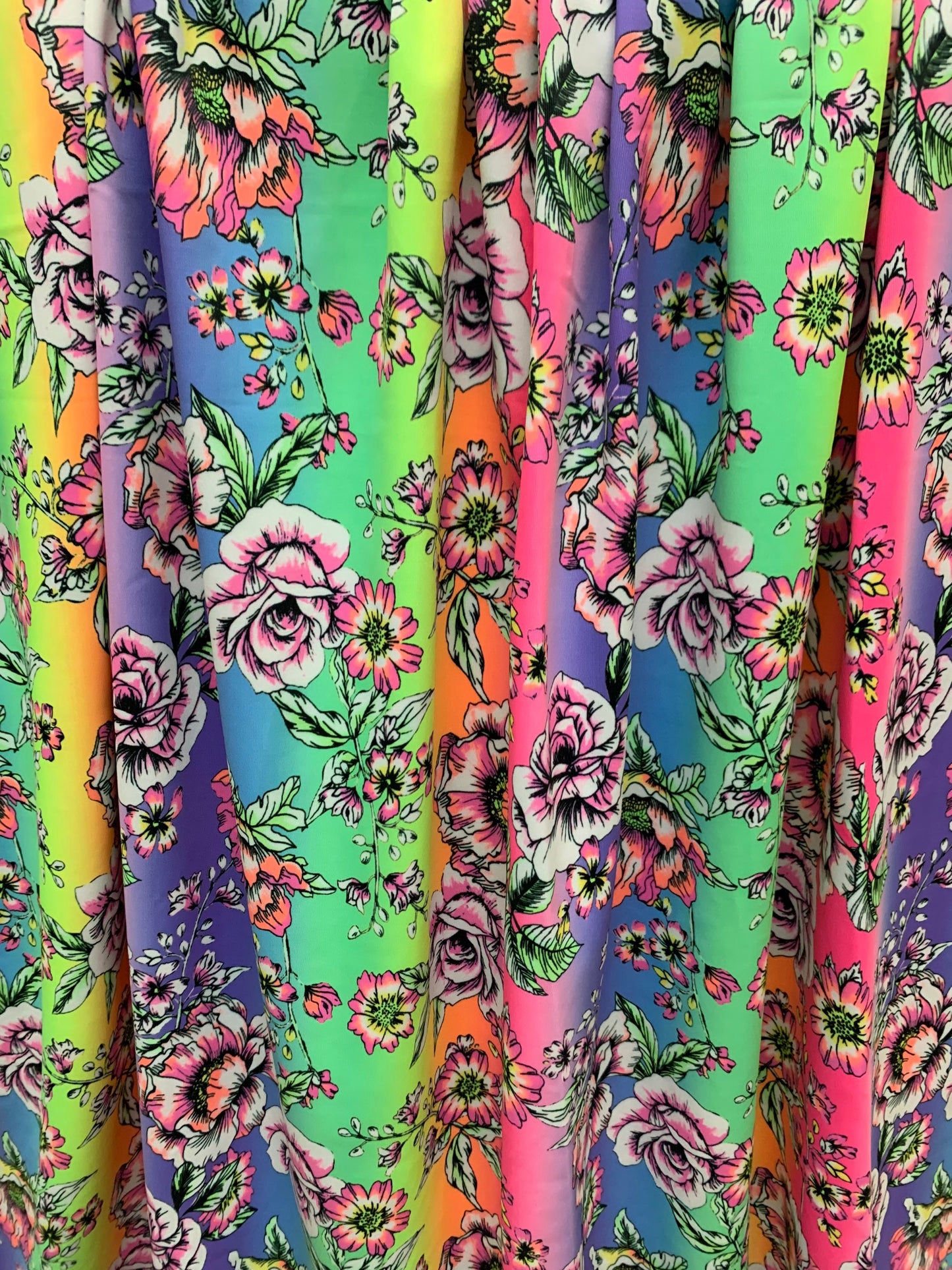 Rainbow and roses design print on the best quality nylon spandex 4-way stretch 58/60”sold by the DY. Ships Worldwide from Los Angeles CA.