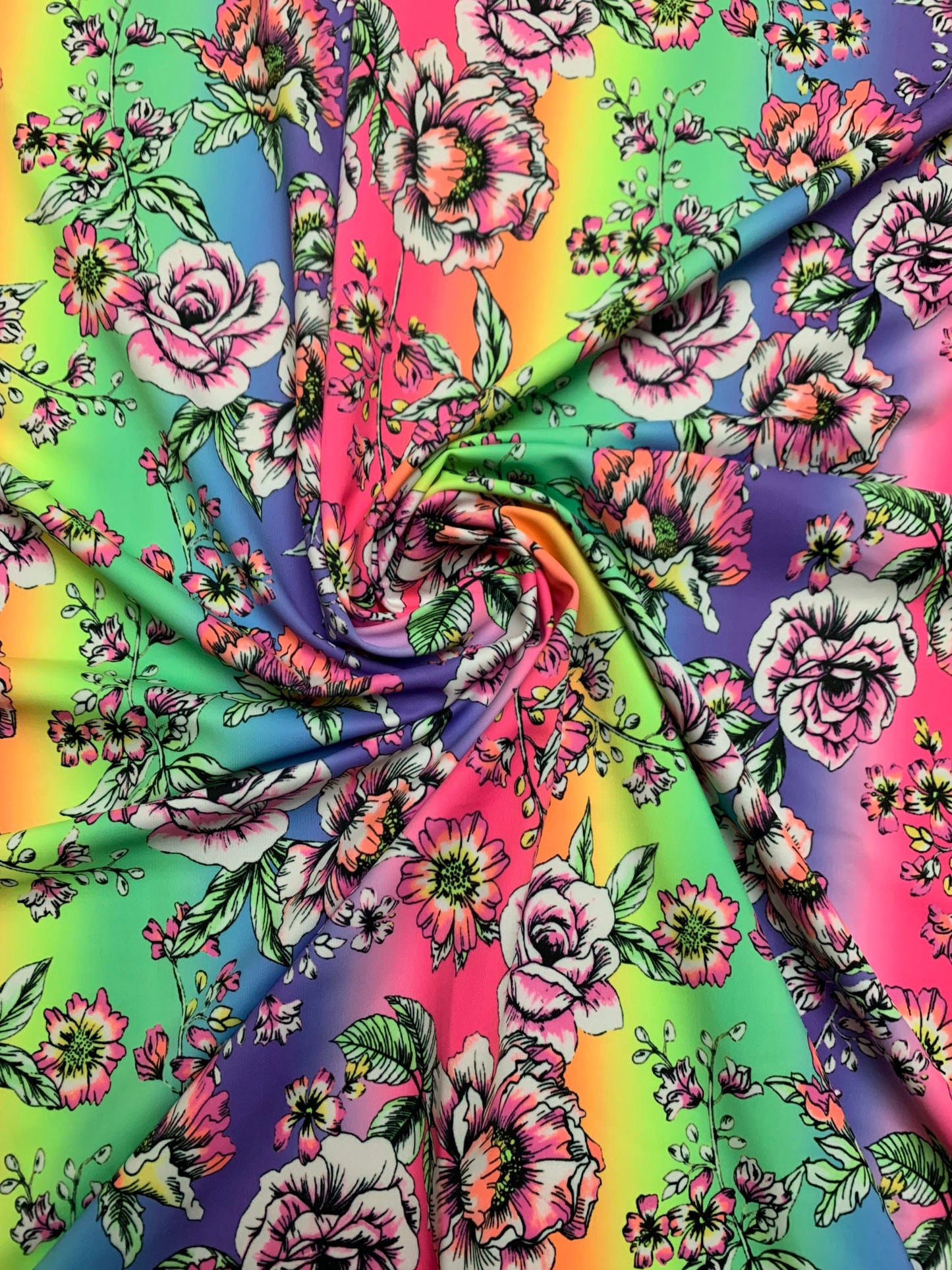 Rainbow and roses design print on the best quality nylon spandex 4-way stretch 58/60”sold by the DY. Ships Worldwide from Los Angeles CA.