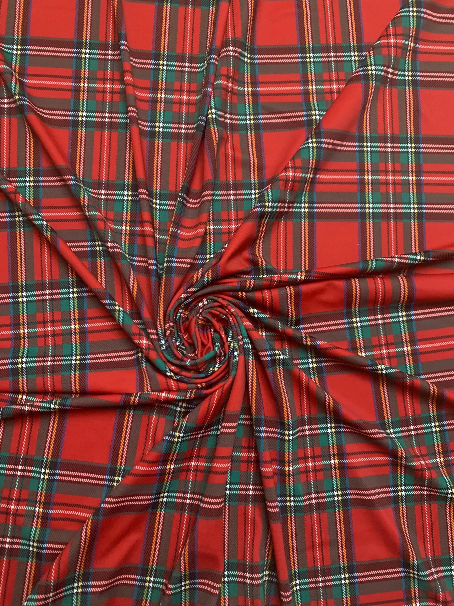 Red & green tartan plaid design print on nylon spandex 4-way stretch 58/60”sold by the YD. ships worldwide from Los Angeles California USA.