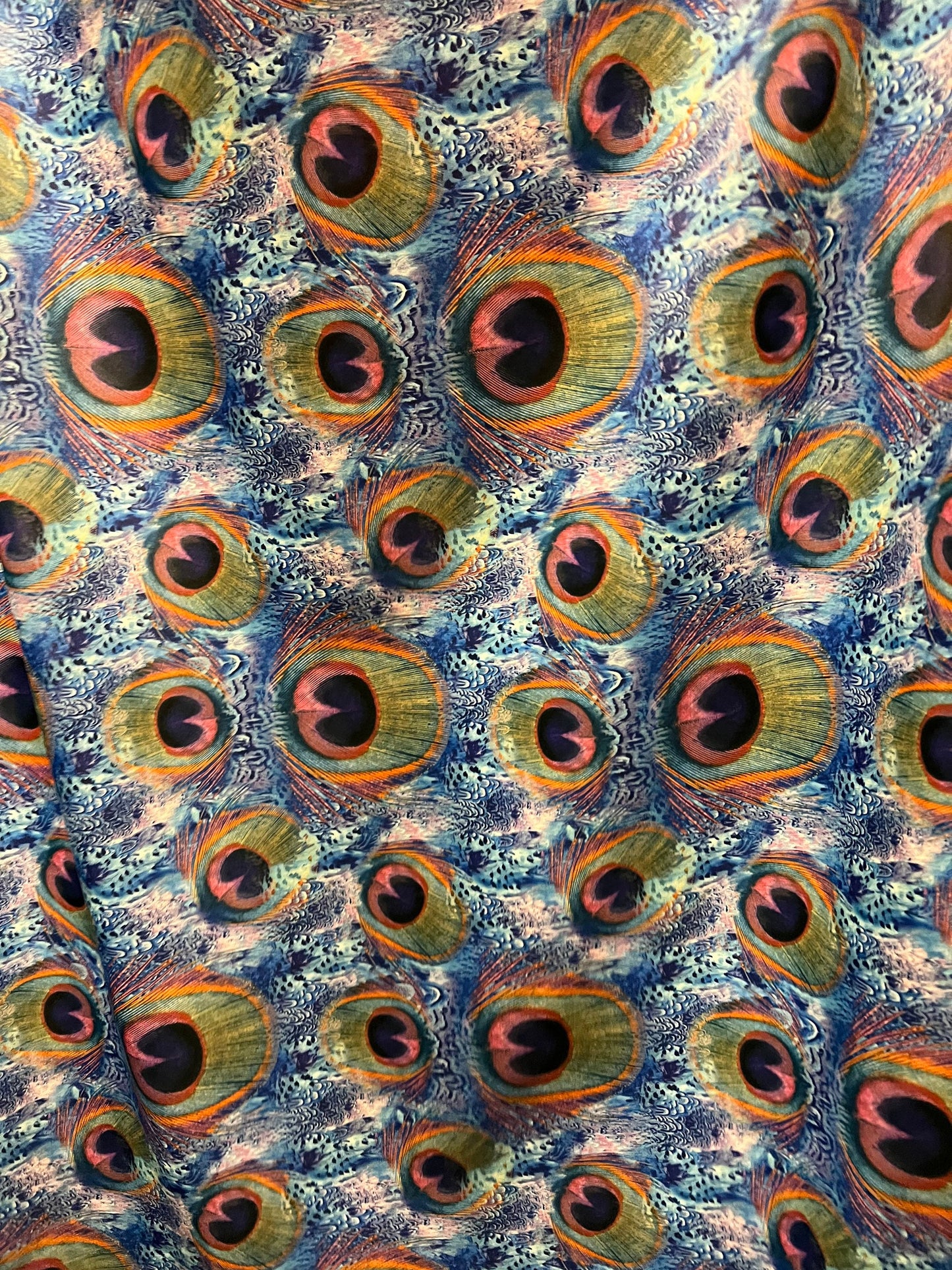 New peacock pattern design print on the best quality of nylon spandex 4-way stretch 58/60” sold by the YD.ships worldwide from Los Angeles.
