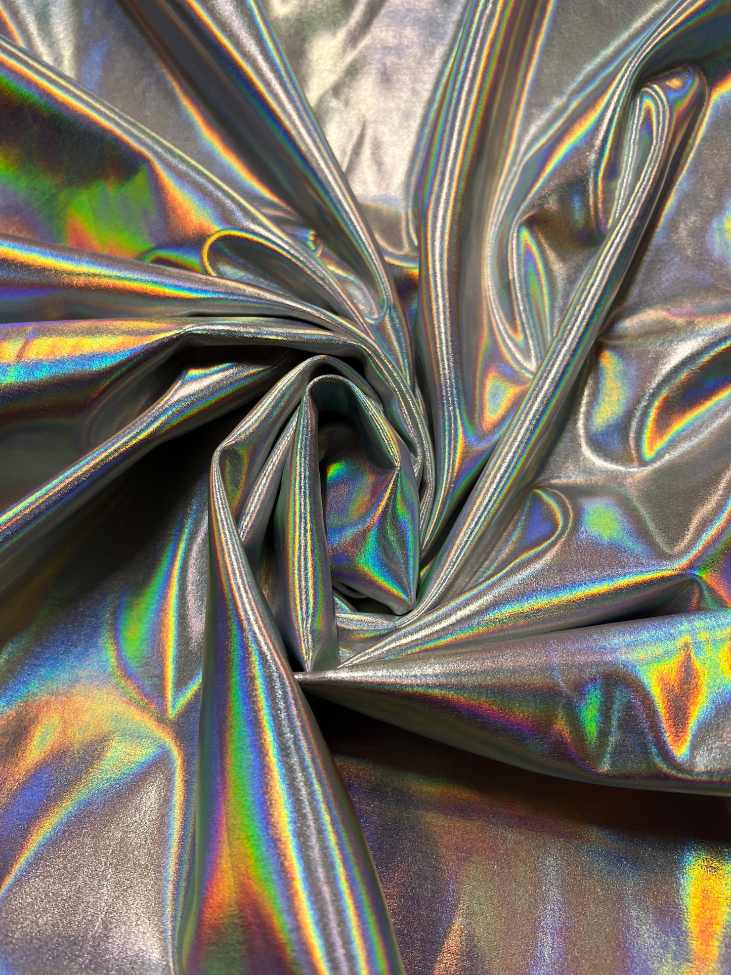 New iridescent/silver all over foil nylon spandex 4-way stretch 58/60”sold by the YD. Ships worldwide from Los Angeles California USA.