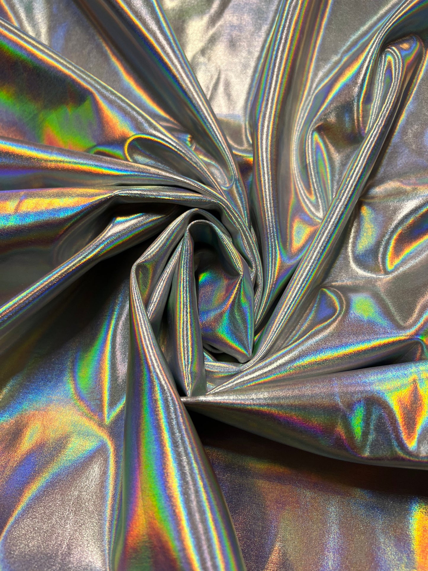 New iridescent/silver all over foil nylon spandex 4-way stretch 58/60”sold by the YD. Ships worldwide from Los Angeles California USA.