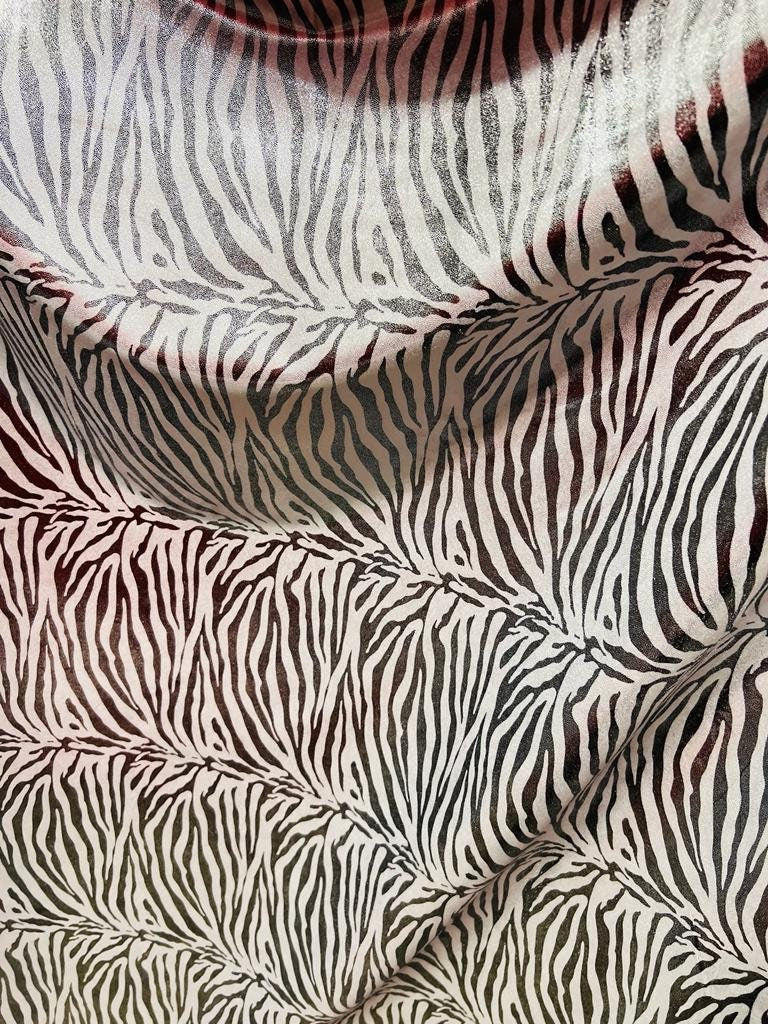 New exotic zebra design with all over foil metallic nylon spandex 4-stretch 58/60”sold by the YD.ships worldwide from Los Angeles California