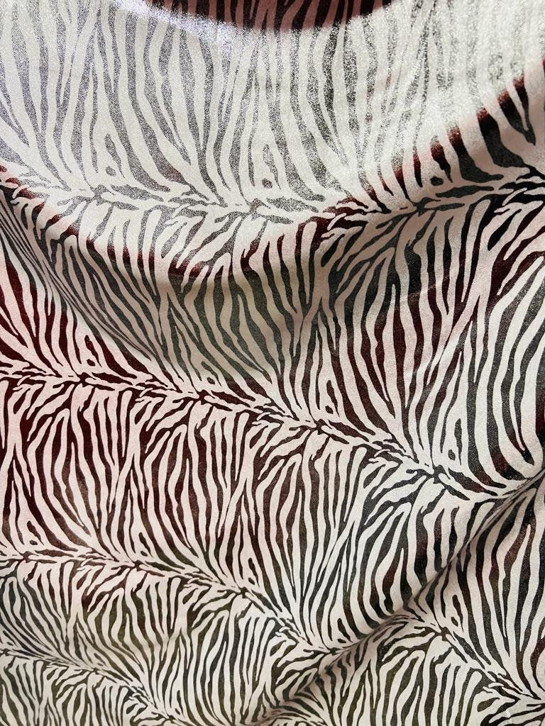 New exotic zebra design with all over foil metallic nylon spandex 4-stretch 58/60”sold by the YD.ships worldwide from Los Angeles California