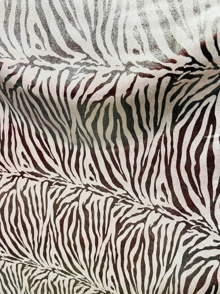 New exotic zebra design with all over foil metallic nylon spandex 4-stretch 58/60”sold by the YD.ships worldwide from Los Angeles California