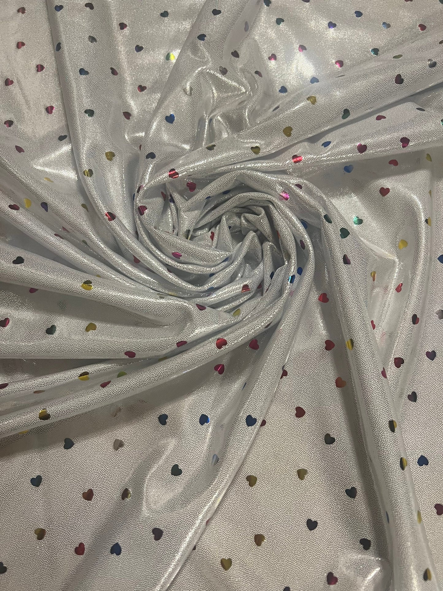 New little hearts hologram design new metallic hologram nylon spandex 4-way stretch 58/60”sold by the YD.Ships worldwide from Los Angeles CA