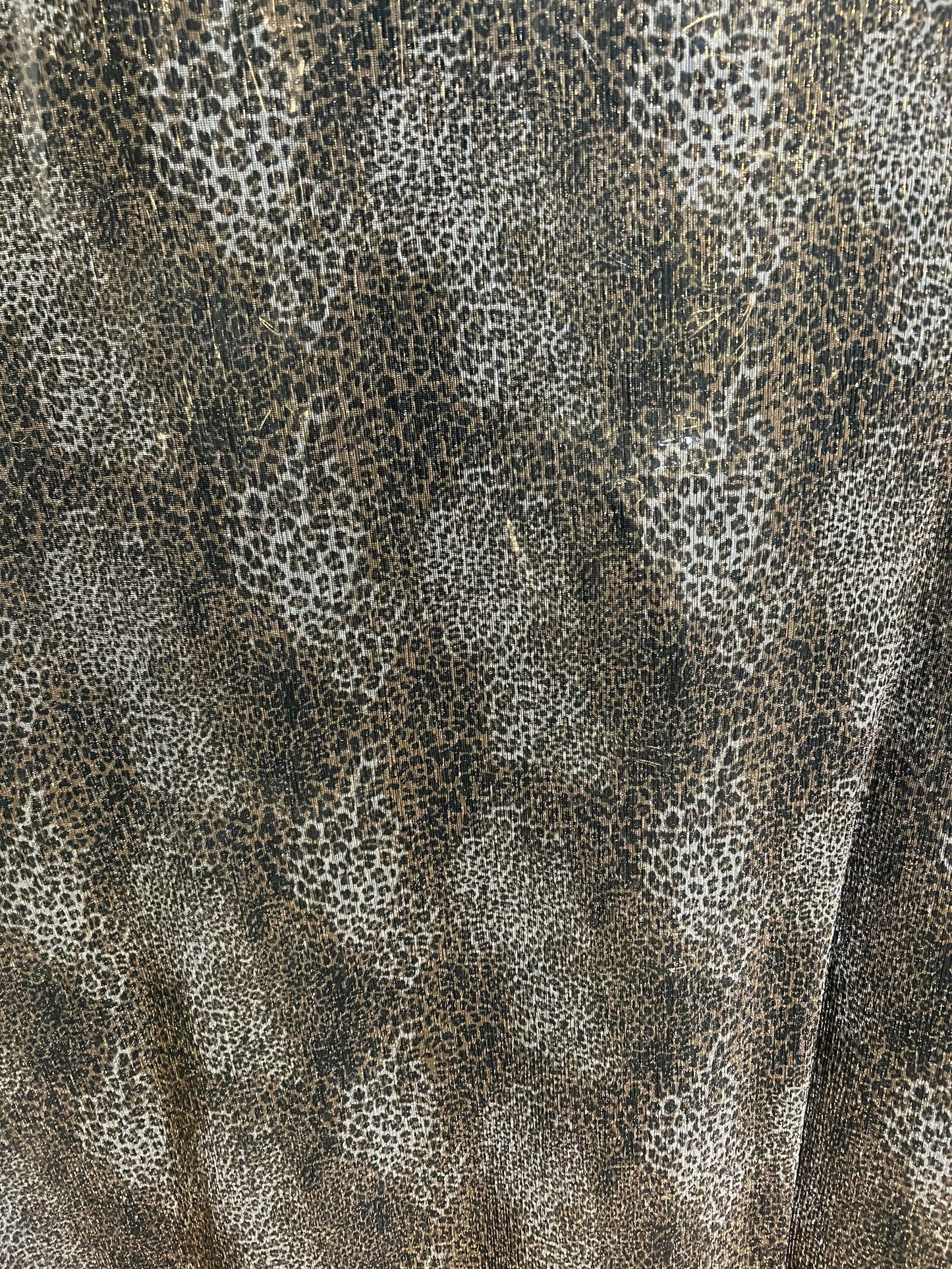 New pleated cheetah design print on metallic mesh 4-way stretch 58/60” Sold by the YD.Ships worldwide from Los Angeles California USA.