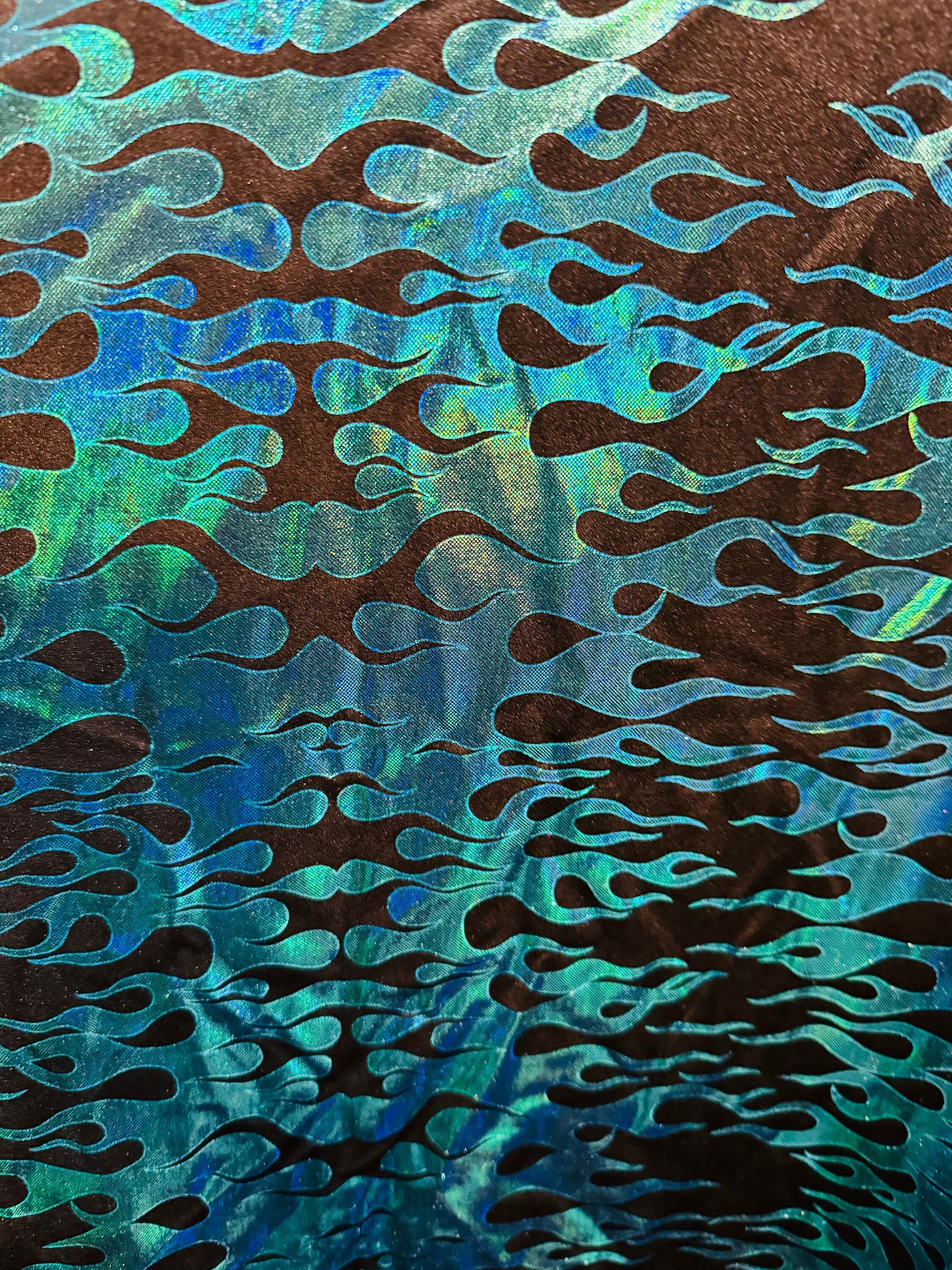 New flames pattern design hologram metallic nylon spandex 4-way stretch 58/60”Sold by the YD. Ships from Los Angeles California USA.
