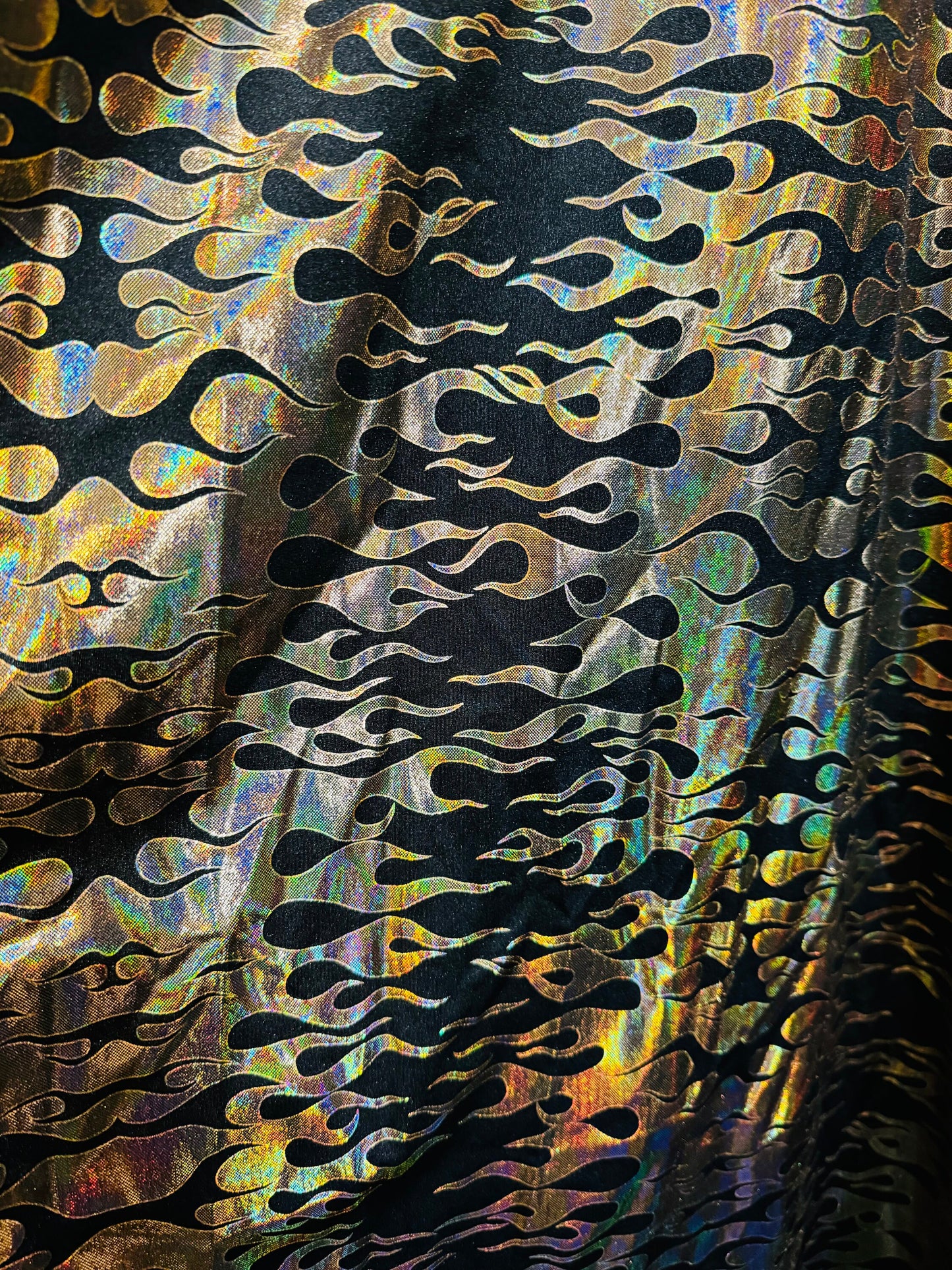 New flames pattern design hologram metallic nylon spandex 4-way stretch 58/60”Sold by the YD. Ships from Los Angeles California USA.