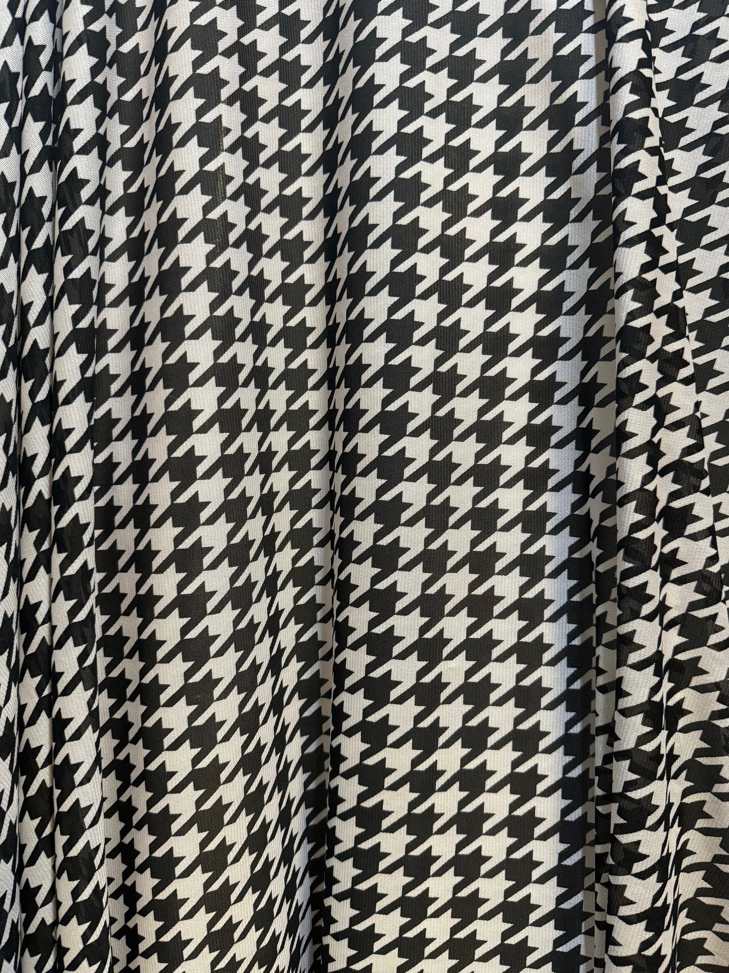 New houndstooth design print on power mesh nylon spandex 4way stretch 58/60”sold by the YD. Ships worldwide from Los Angeles California USA.