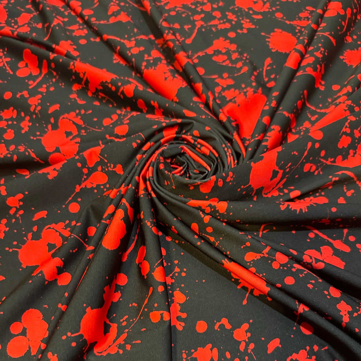 New Colorful red splatter paint design print on the best quality of nylon spandex 4way stretch 58/60” Sold by the YD.Ships worldwide from LA