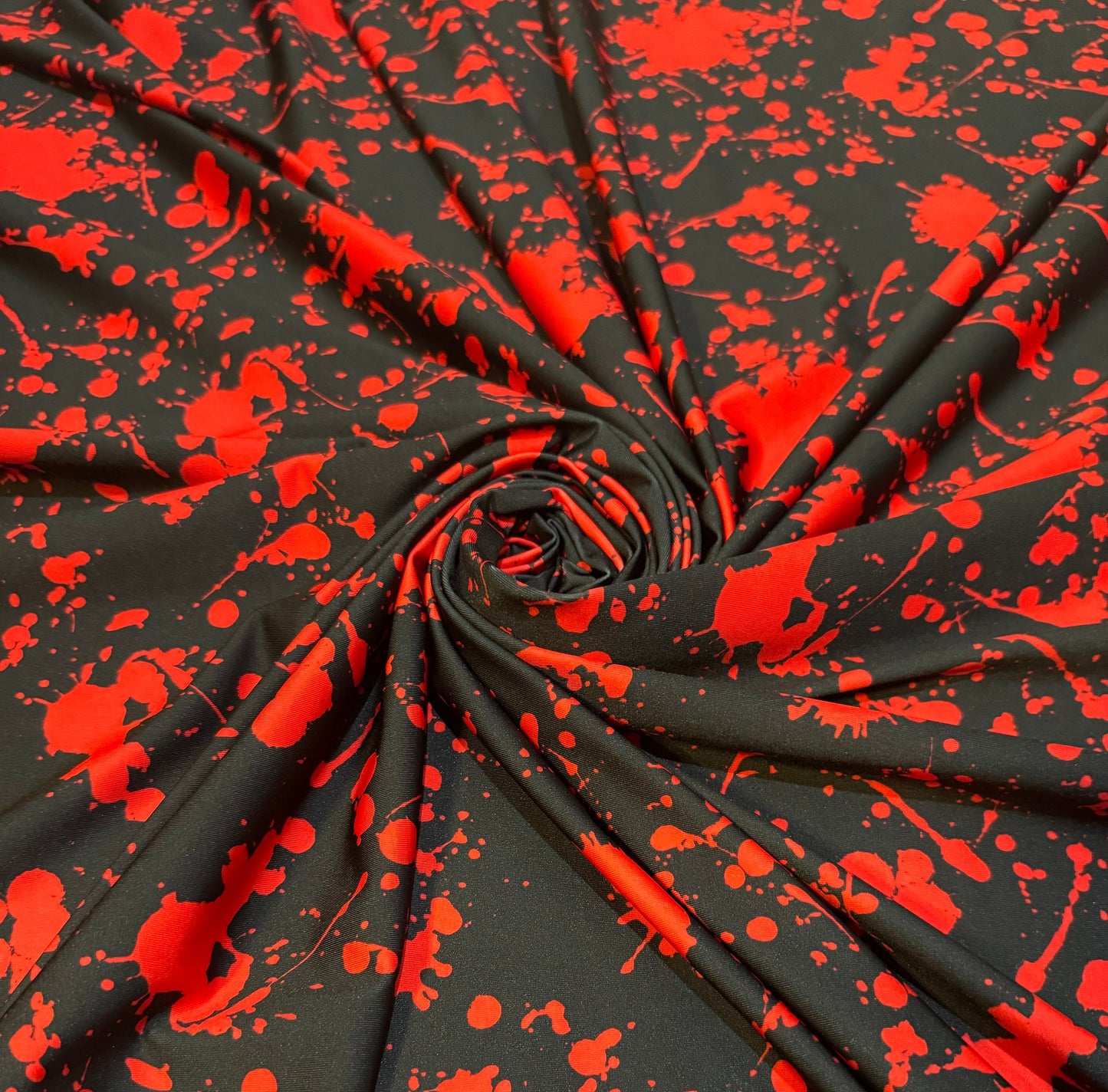 New Colorful red splatter paint design print on the best quality of nylon spandex 4way stretch 58/60” Sold by the YD.Ships worldwide from LA