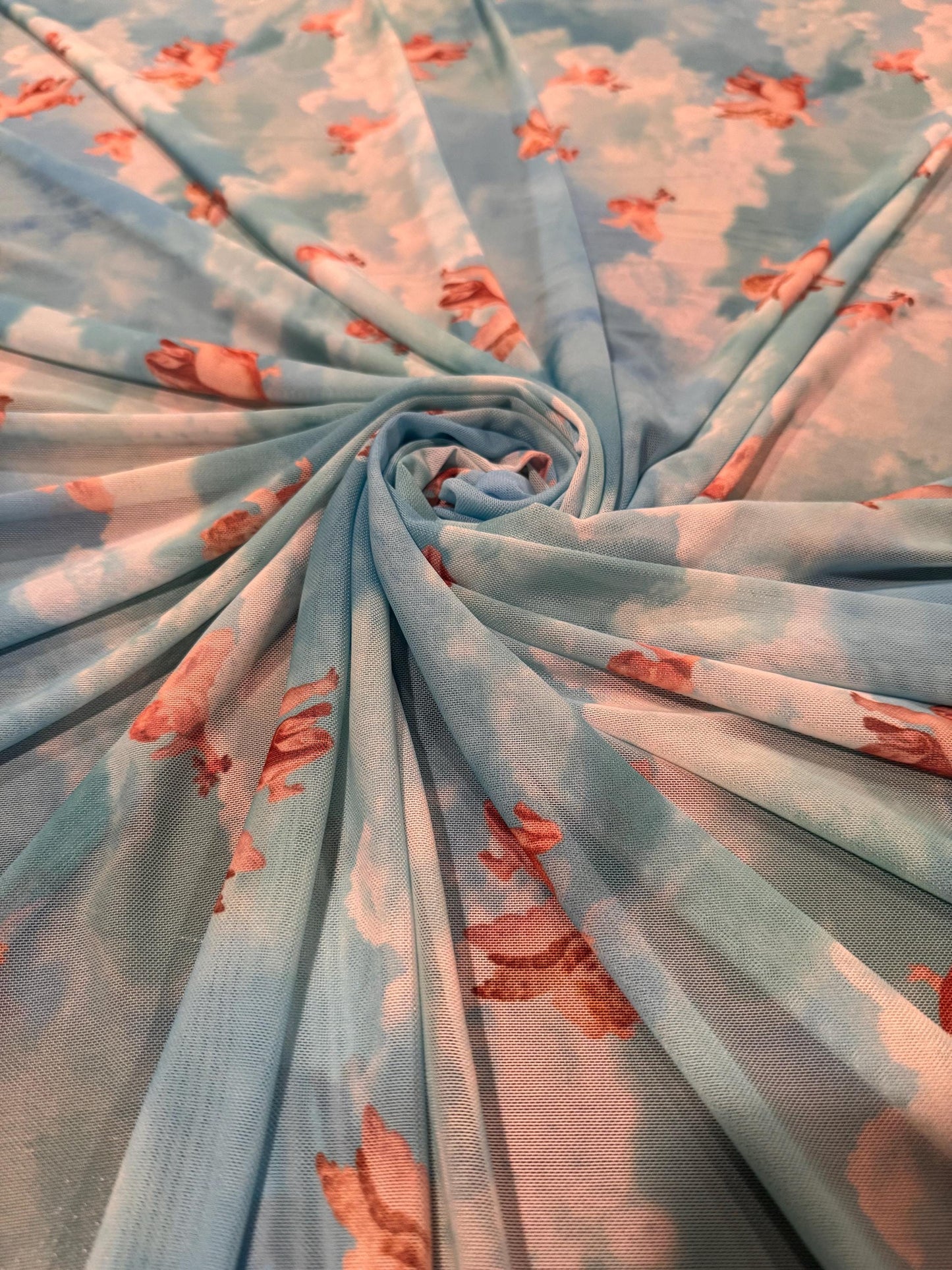 New Cherubim Angels design print on power mesh 4-way stretch 58/60”sold by the YD. Ships worldwide from Los Angeles California USA.