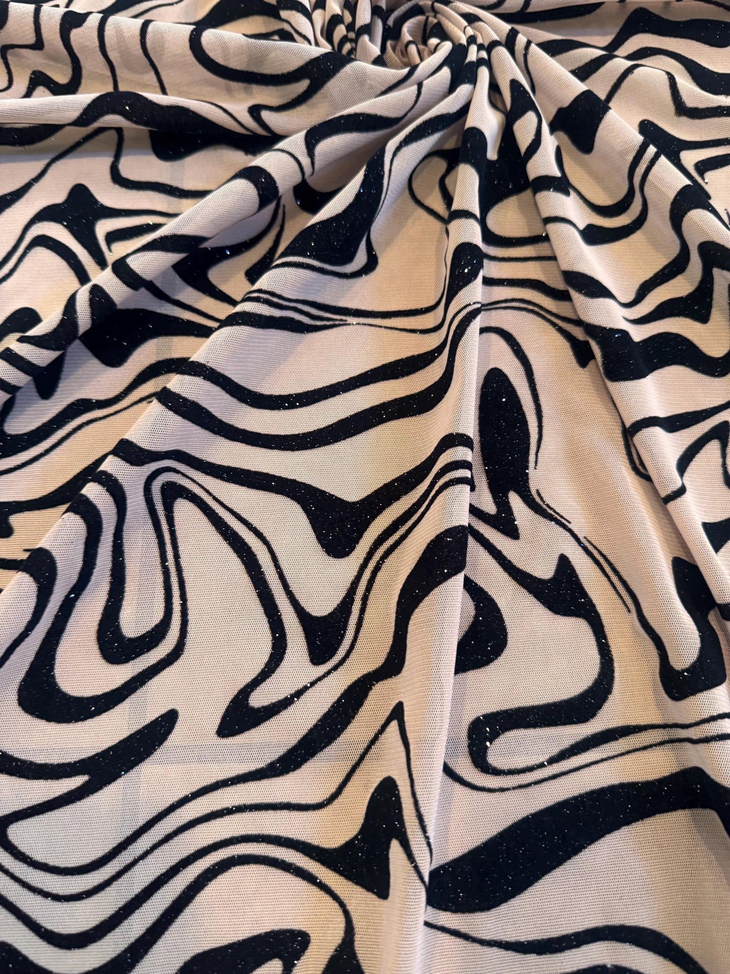 Modern abstract mesh with floking design nylon spandex 4-way stretch 58/60” sold by the YD.ships worldwide from Los Ángeles CA.