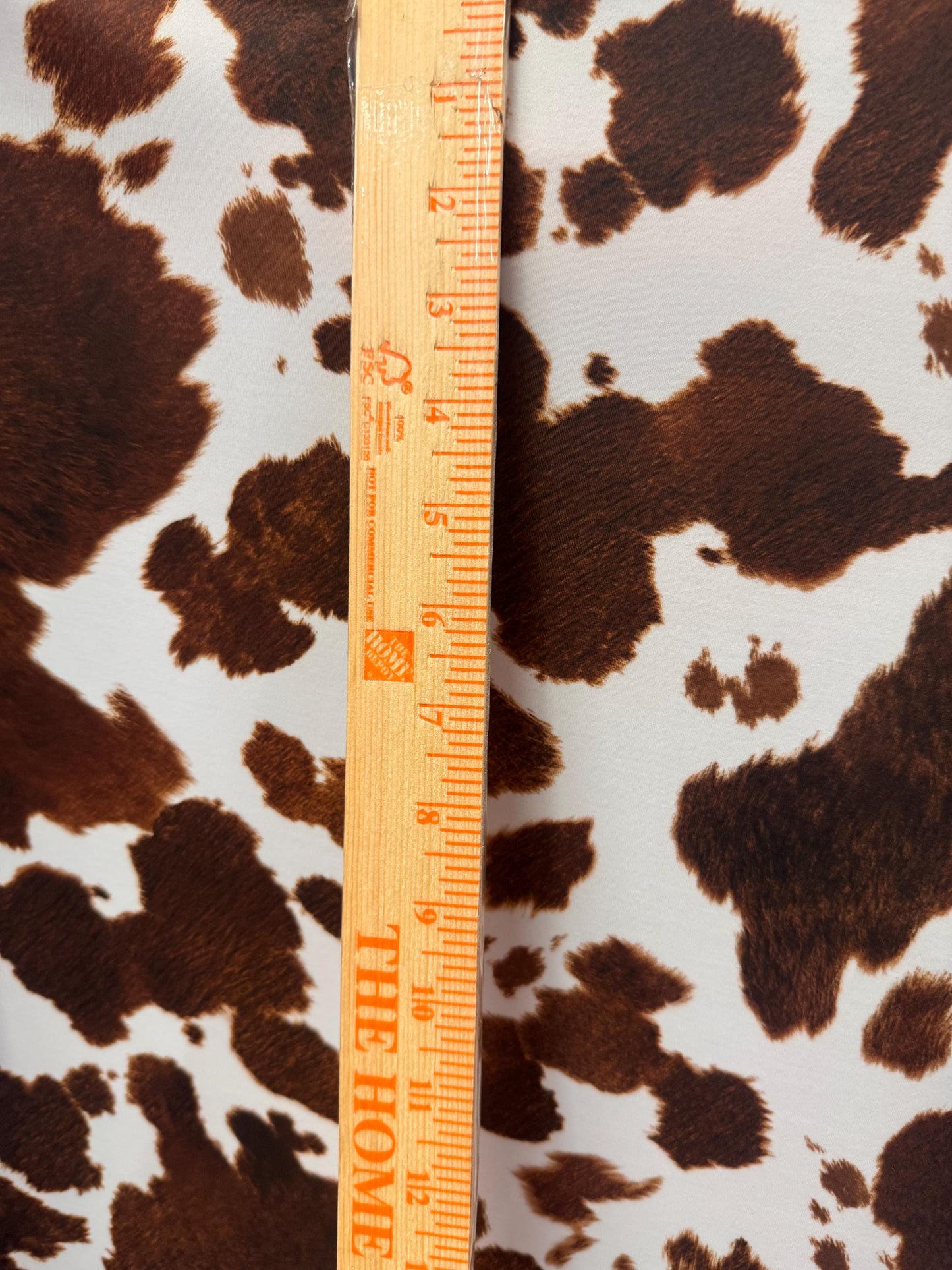 New Brown/White cow design print on best quality of nylon spandex 4-way stretch 58/60”sold by the YD. ships Worldwide from Los Angeles CA