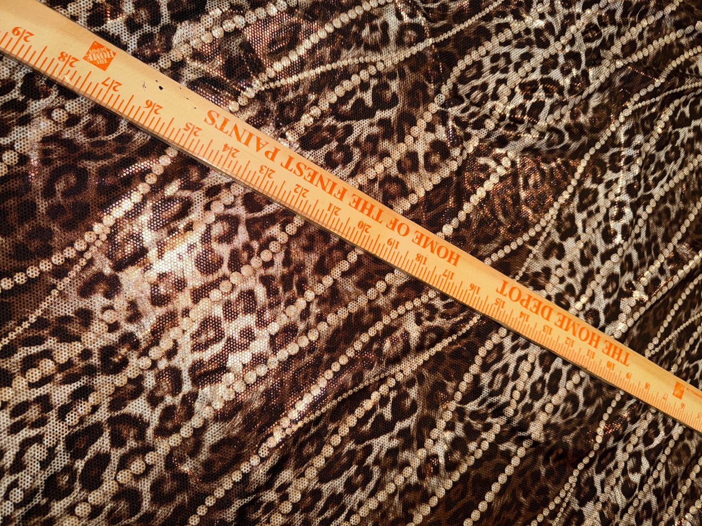 New Skin leopard and pearls design metallic poly spandex 4-way stretch 58/60”Sold by the YD.Ships worldwide from Los Angeles California USA.