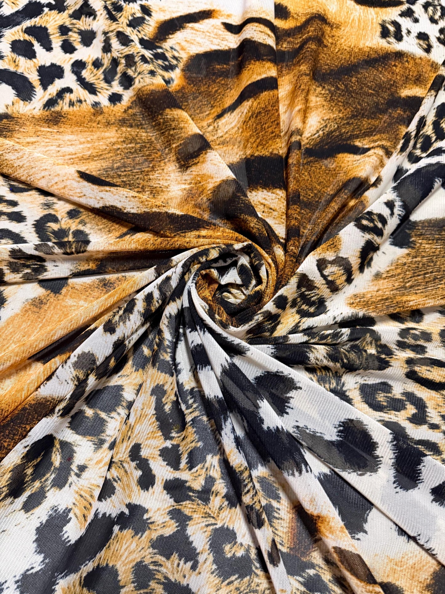 New abstract animal design print on power mesh 4-way stretch 58/60”sold by the YD. Ships worldwide from Los Angeles California USA.