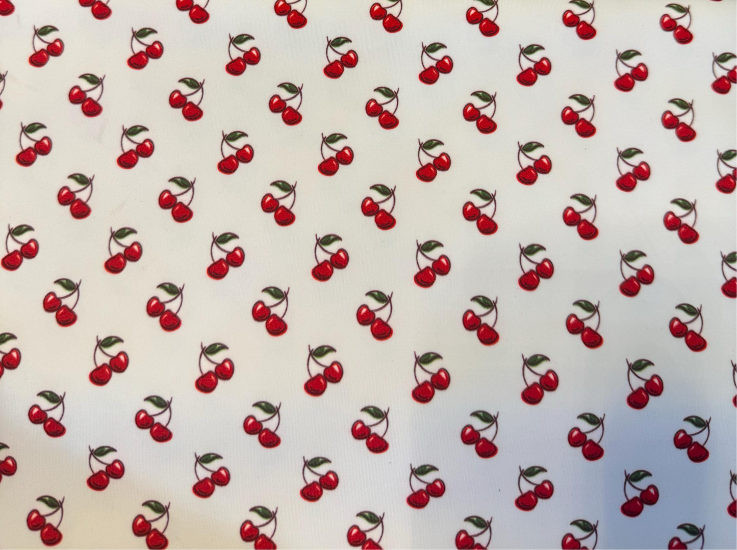 Red cherries design print on the best quality of nylon spandex 4-way stretch 58/60”sold by the YD.Ships Worldwide from Los Angeles CA.