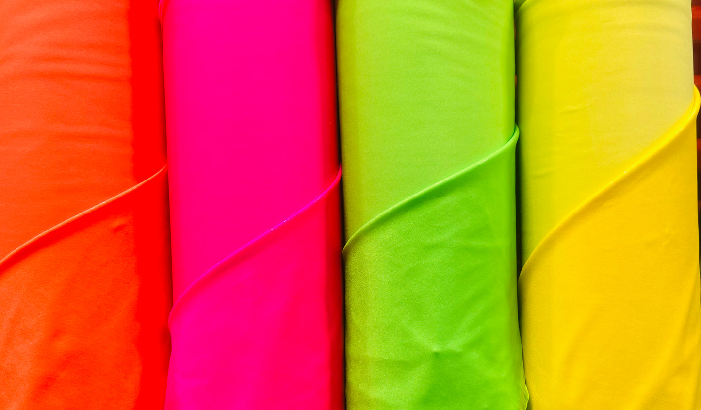 New Neon colors with clear foggy foil nylon spandex 4-way stretch 58/60”sold by the yard.Ships worldwide from Los Angeles California USA.