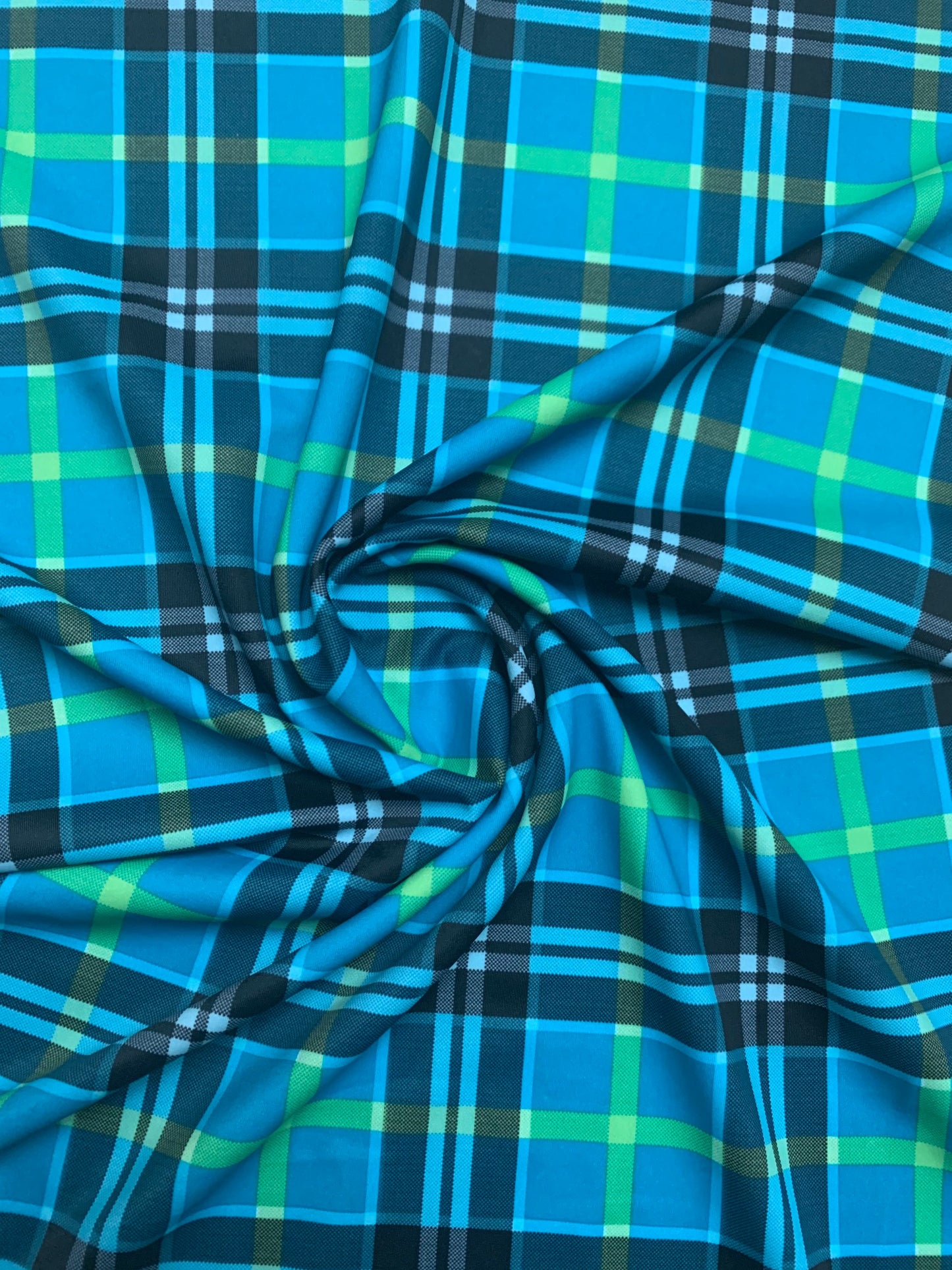 Plaid tartan design print on the best quality nylon spandex 4- way stretch 58/60”solid by the YD. ships Worldwide from Los Angeles ca USA.