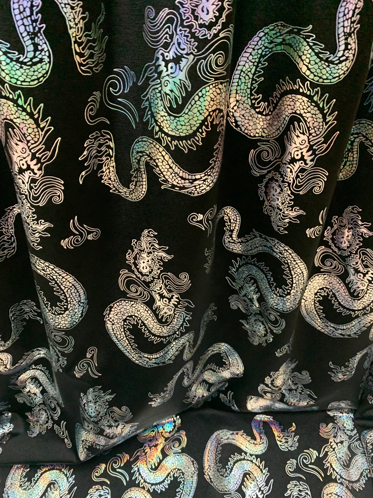 Beautiful iridescent dragon design print on the best quality nylon spandex 4-way stretch 58/60”sold by the YD. ships worldwide from LA