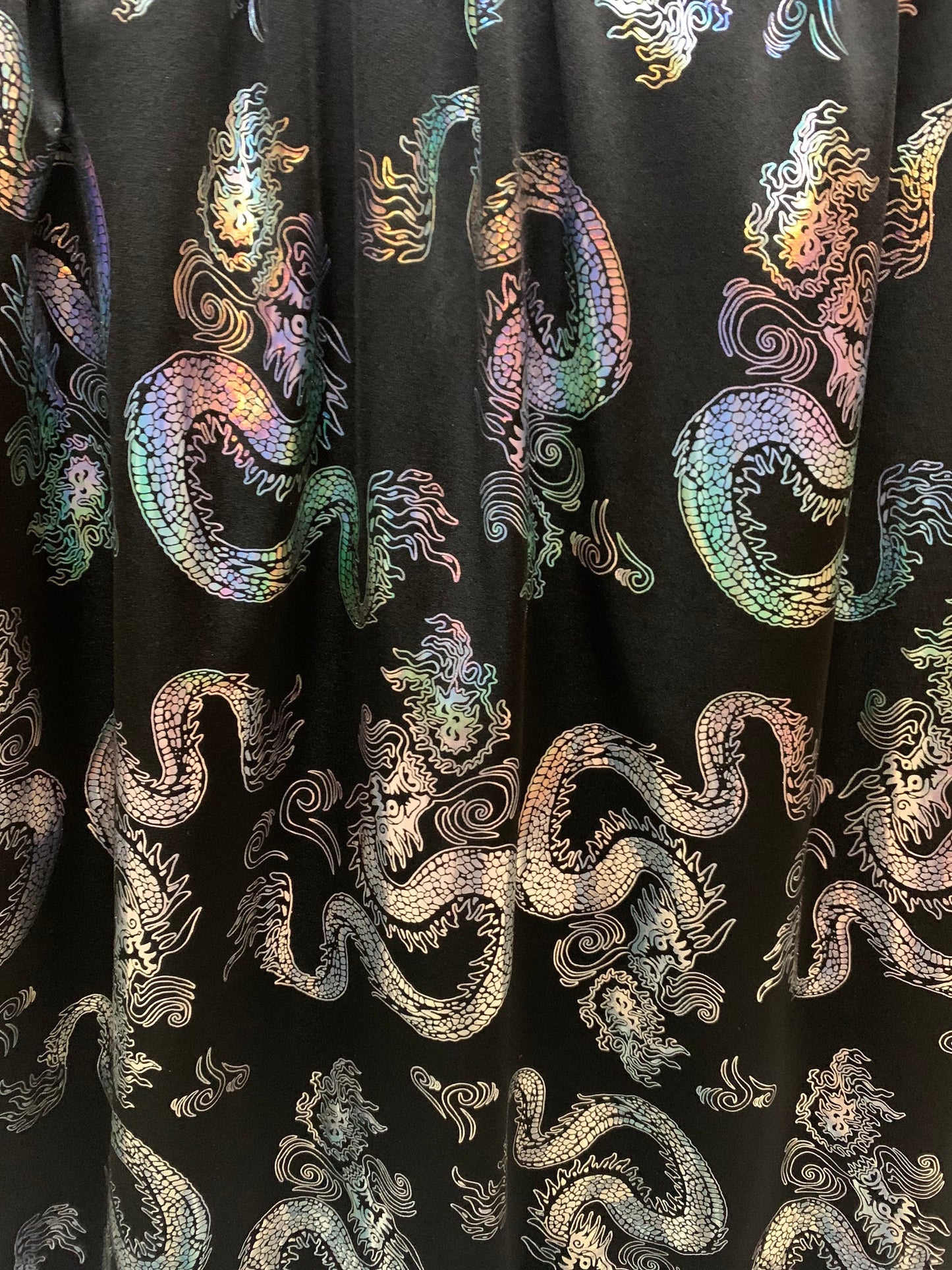 Beautiful iridescent metallic dragon design print on the best quality nylon spandex 4-way stretch 58/60”sold by the YD. ships worldwide from LA