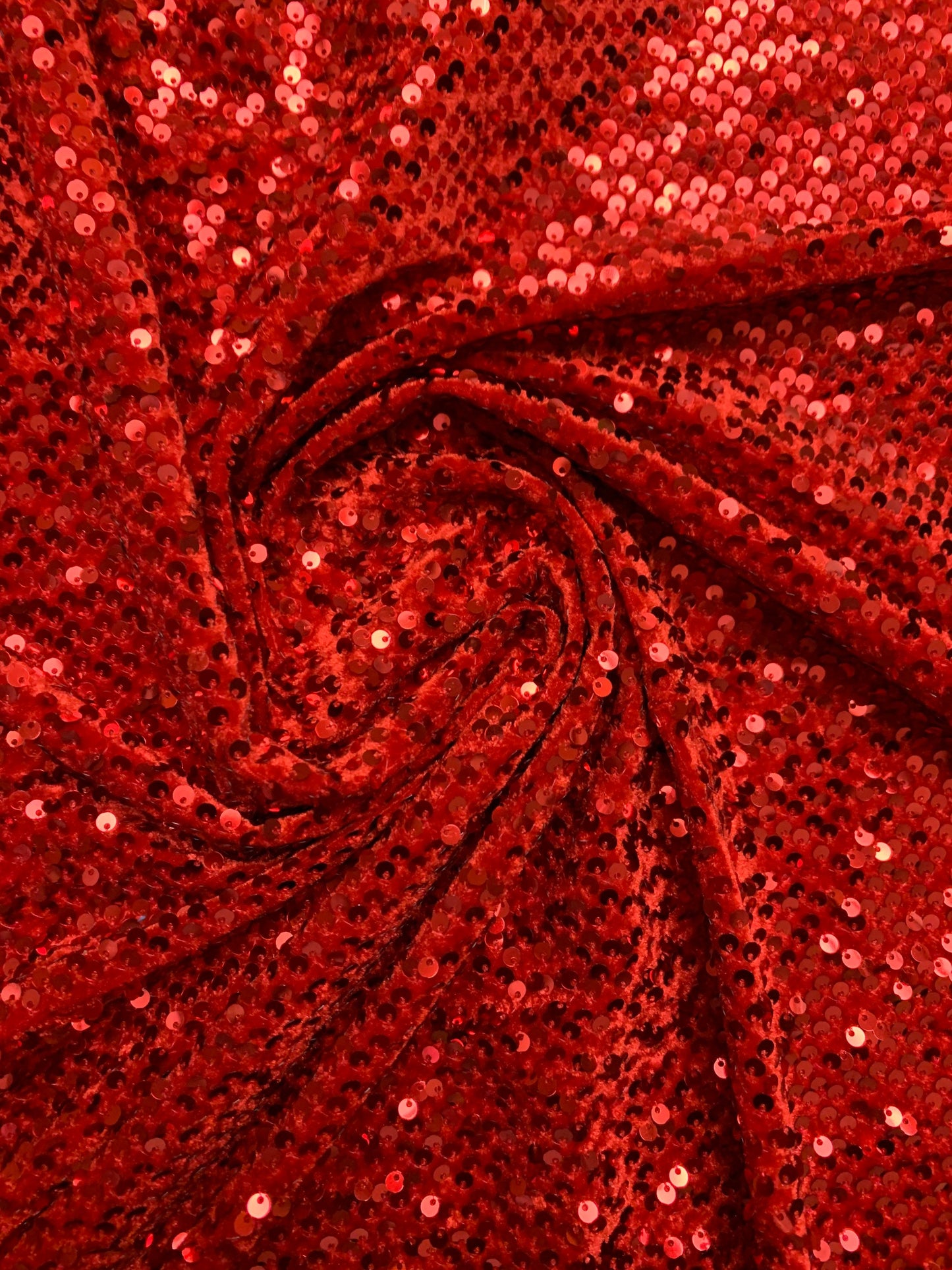 Luxury stretch velvet sequins embroidered on stretch velvet 4-way stretch 58/60”sold by the YD. ships Worldwide from Los Angeles CA USA.