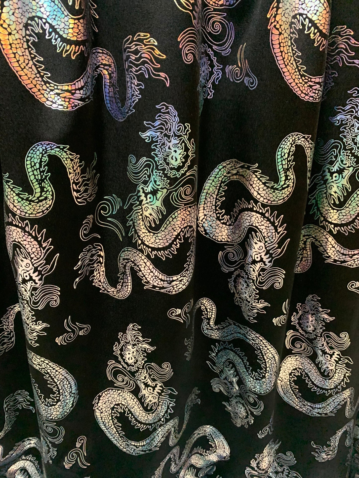 Beautiful iridescent dragon design print on the best quality nylon spandex 4-way stretch 58/60”sold by the YD. ships worldwide from LA