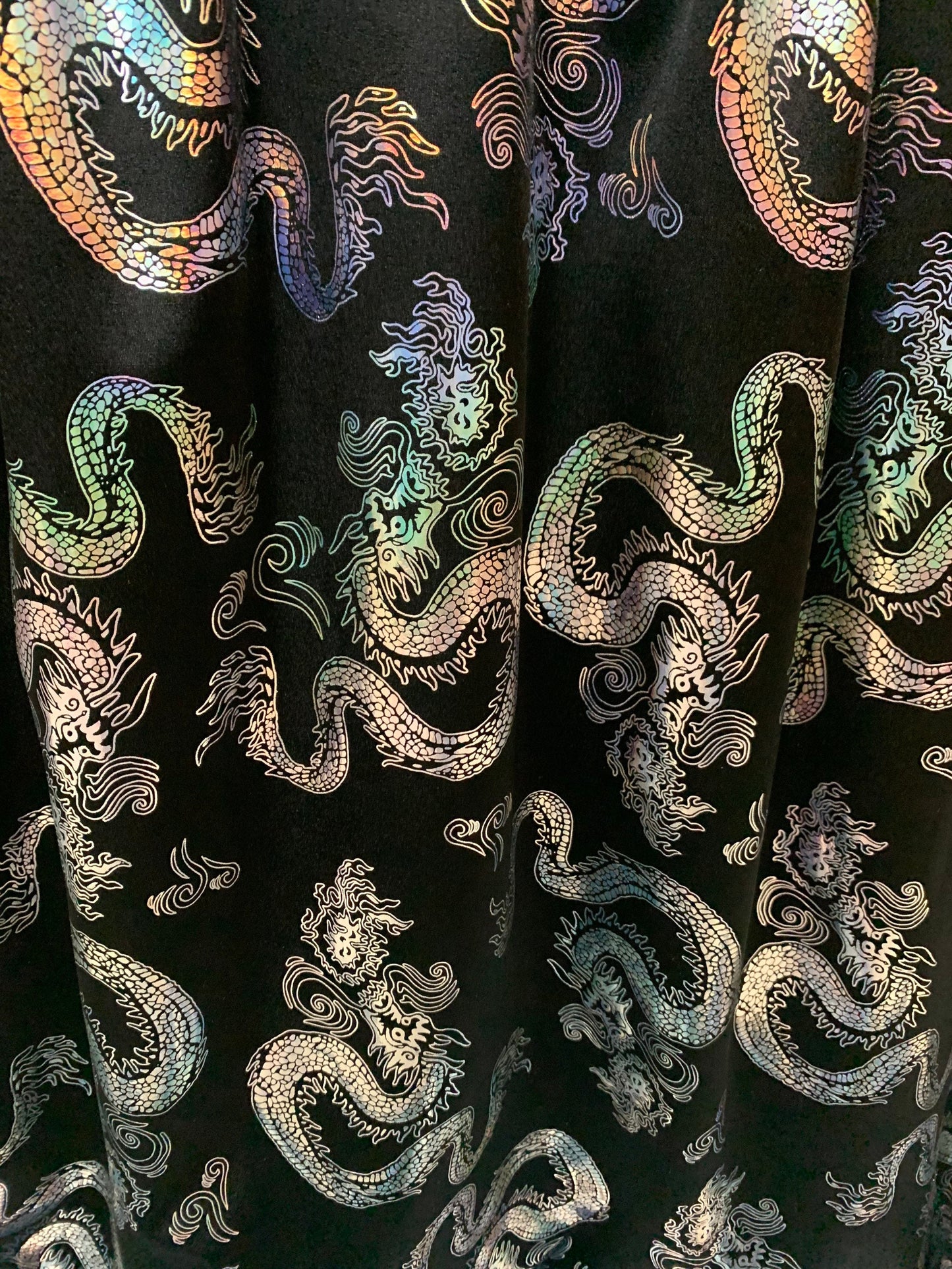 Beautiful iridescent metallic dragon design print on the best quality nylon spandex 4-way stretch 58/60”sold by the YD. ships worldwide from LA