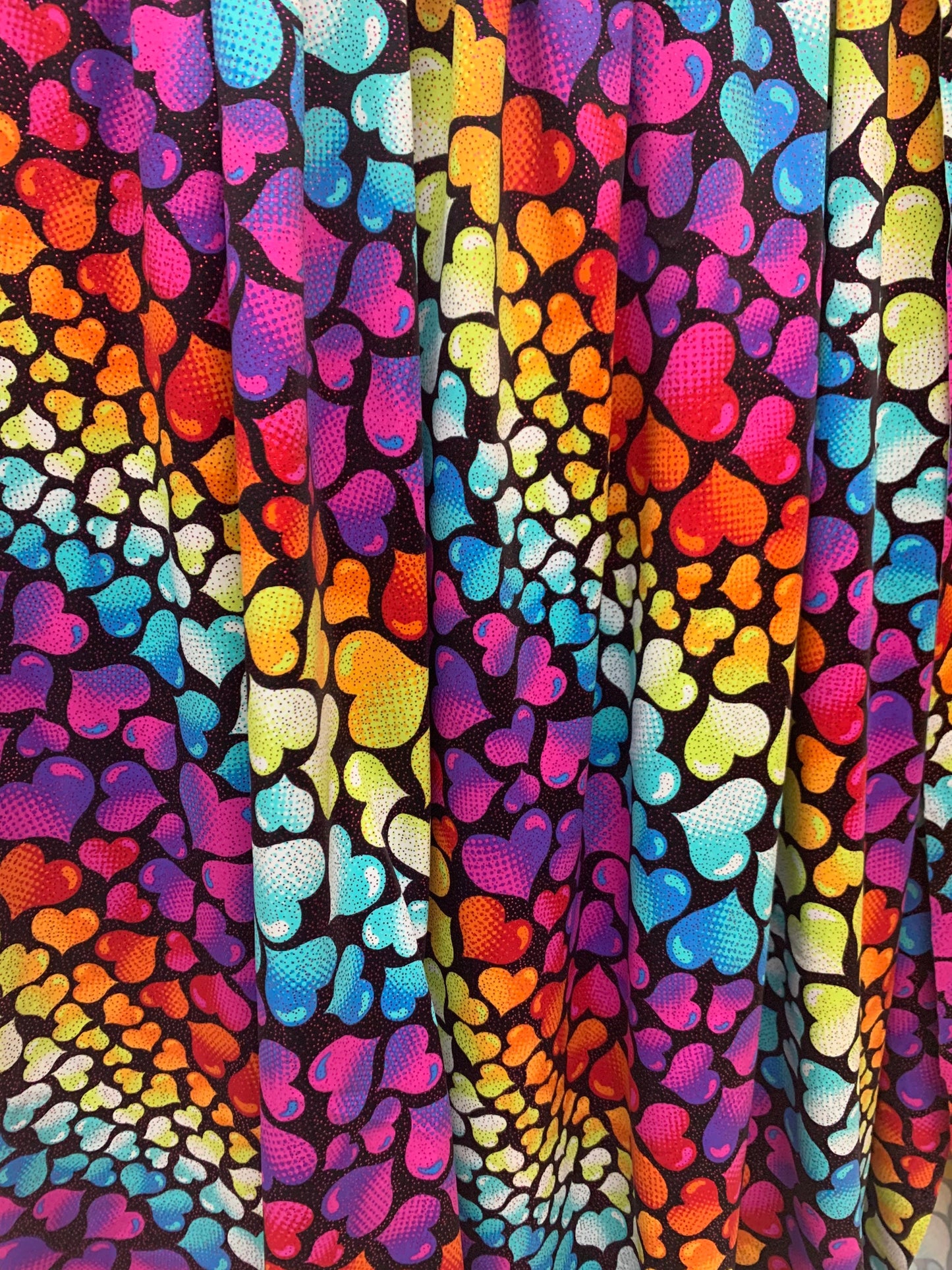 Bright colored hearts design w/foil print nylon spandex 4-way stretch58/60”sold by the YD. ships Worldwide from Los Ángeles CA.