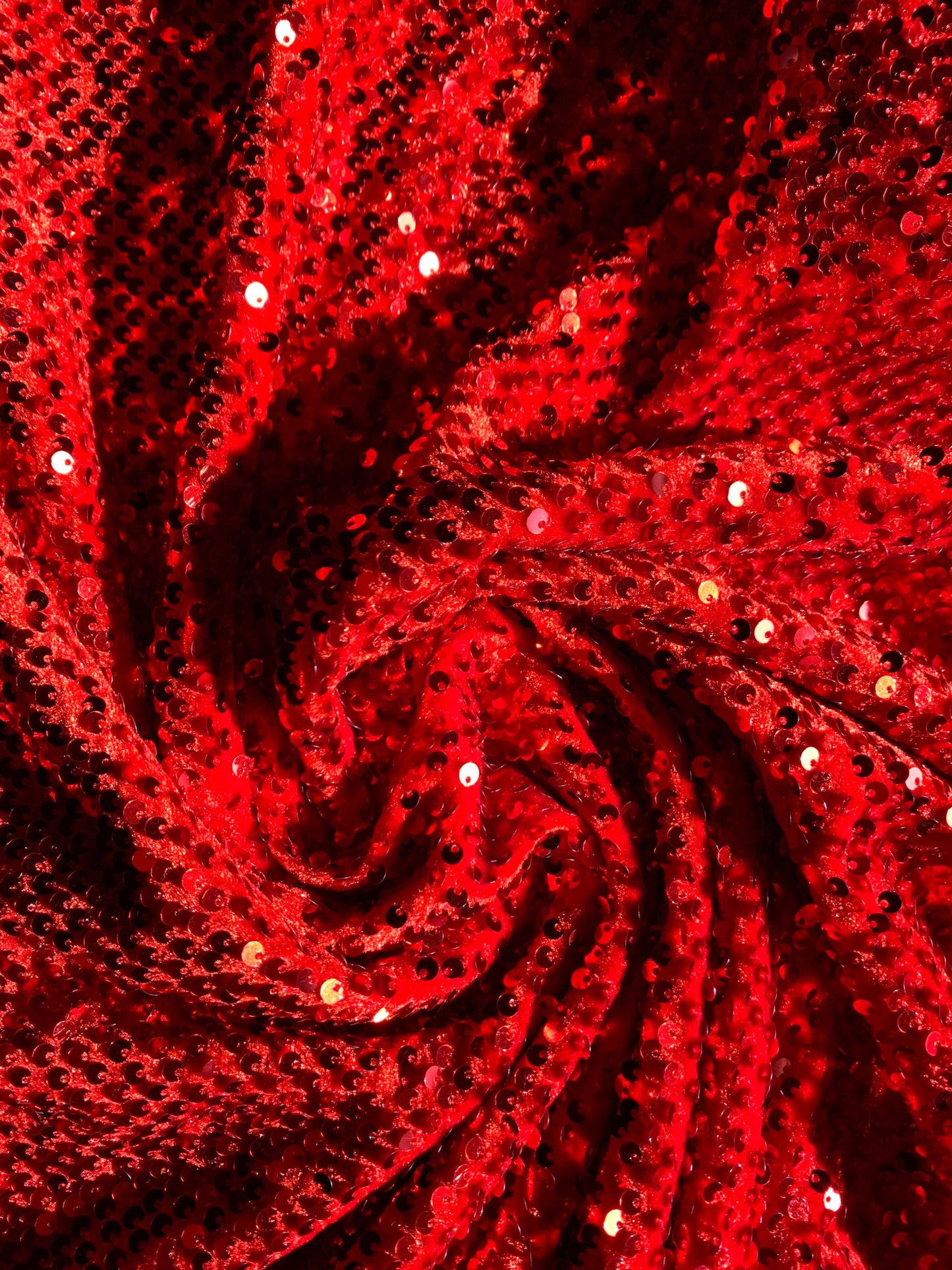 Luxury stretch velvet sequins embroidered on stretch velvet 4-way stretch 58/60”sold by the YD. ships Worldwide from Los Angeles CA USA.