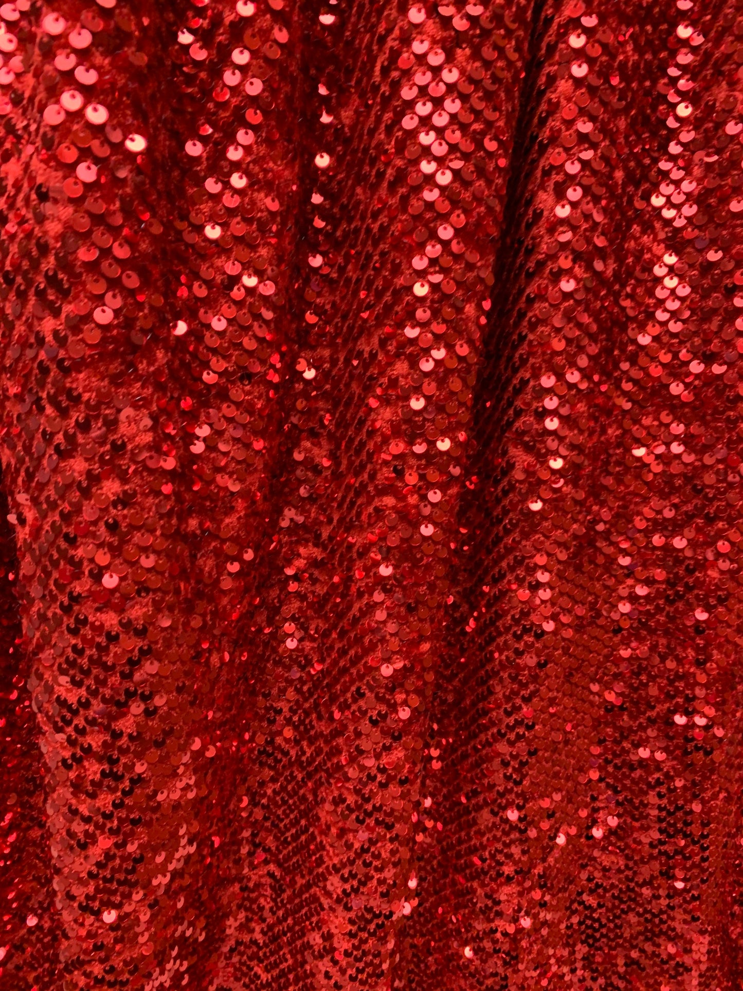 Luxury stretch velvet sequins embroidered on stretch velvet 4-way stretch 58/60”sold by the YD. ships Worldwide from Los Angeles CA USA.