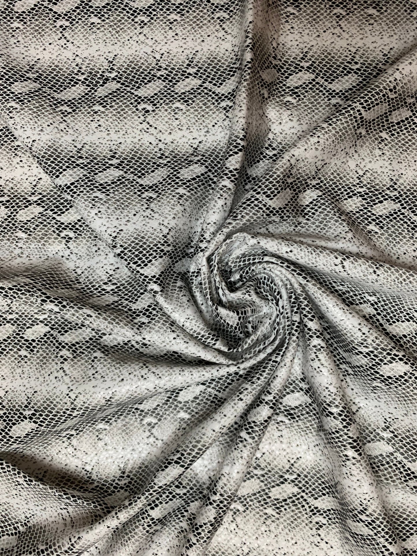 Skin snake pattern design print on the best quality nylon spandex with clear foil 4-way stretch 58/60”sold by the YD.ships worldwide from Los Angeles CA USA