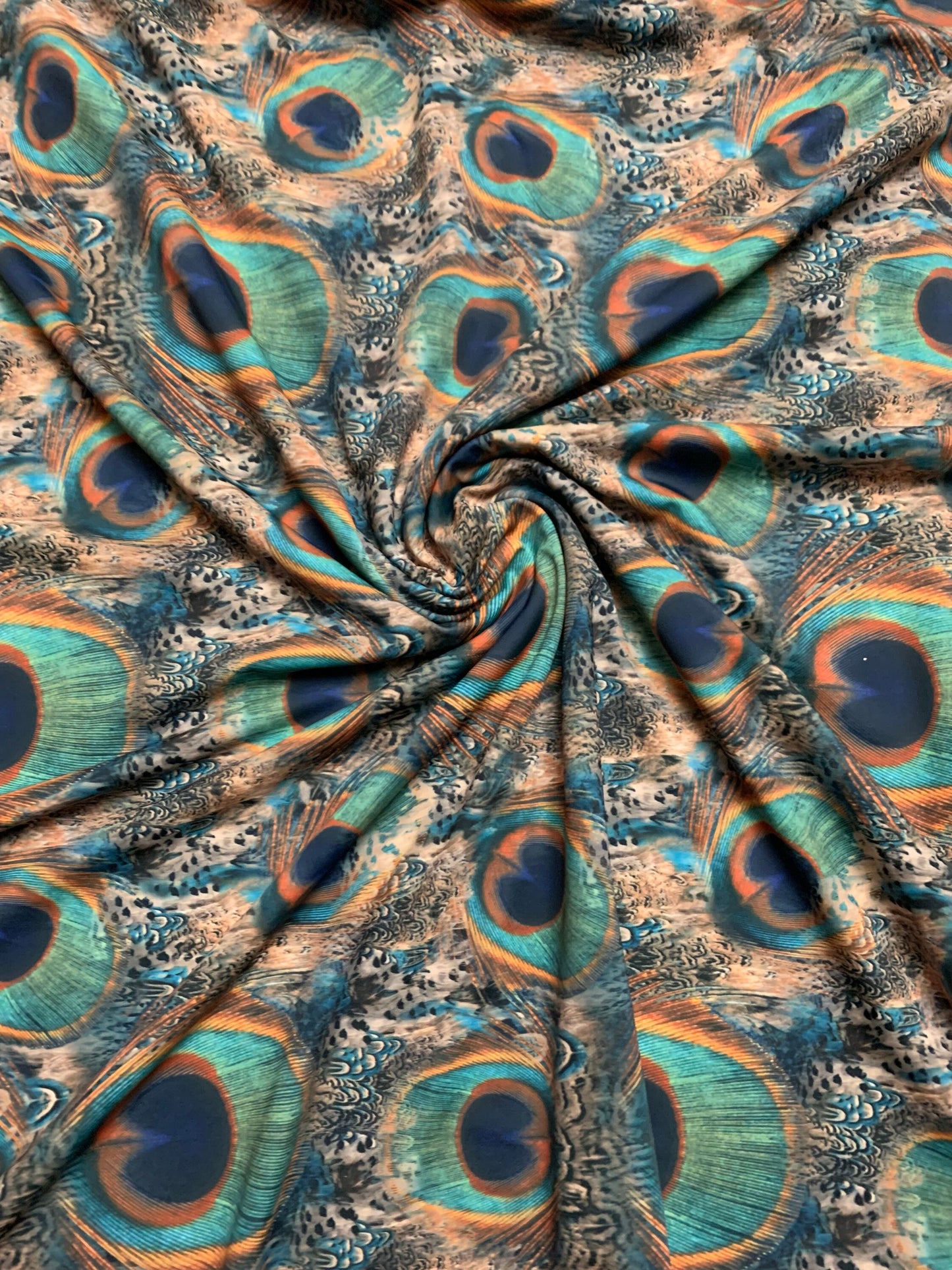 Peacock feather design print on the best quality nylon spandex 4-way stretch 58/60”sold by the YD.ships worldwide from Los Angeles CA USA.