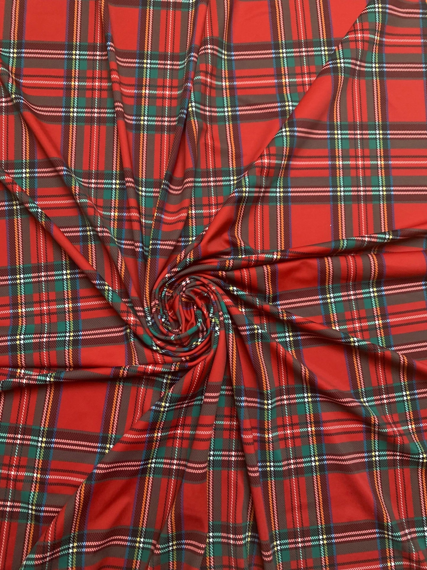 Red & green tartan plaid design print on nylon spandex 4-way stretch 58/60”sold by the YD. ships worldwide from  Los Angeles California USA.