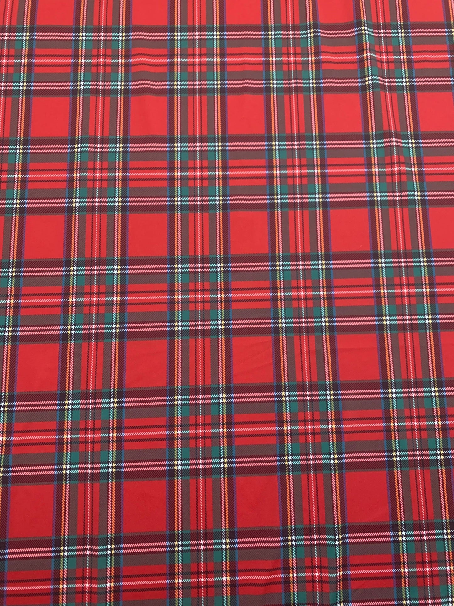 Red & green tartan plaid design print on nylon spandex 4-way stretch 58/60”sold by the YD. ships worldwide from  Los Angeles California USA.