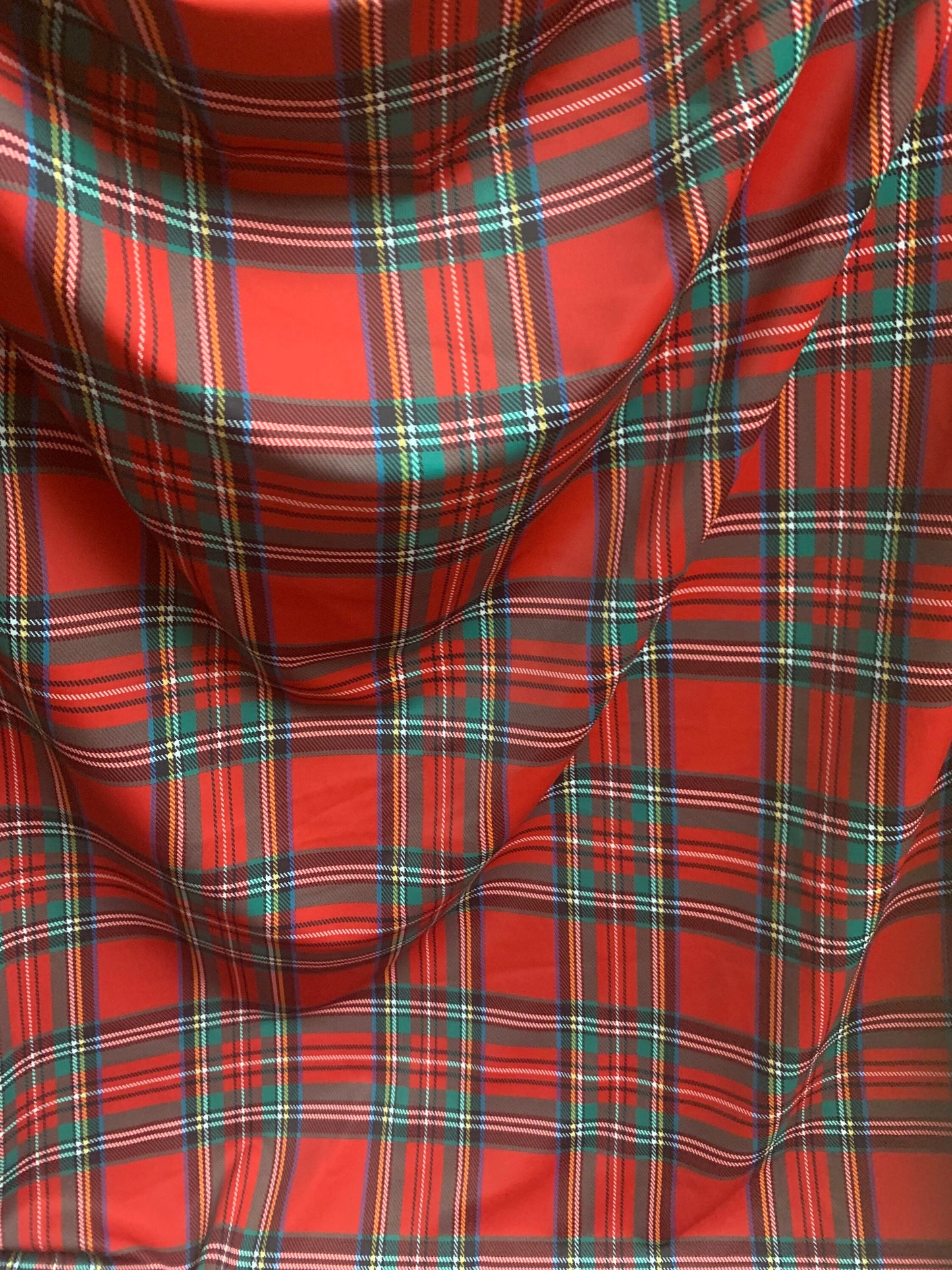 Red & green tartan plaid design print on nylon spandex 4-way stretch 58/60”sold by the YD. ships worldwide from  Los Angeles California USA.