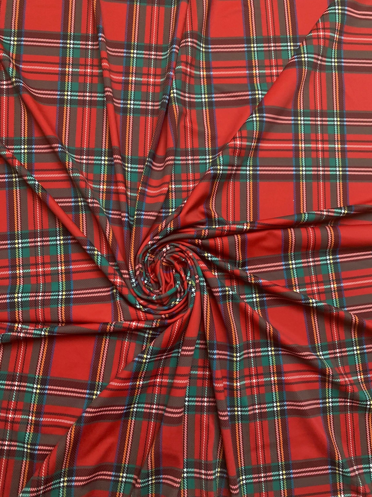 Red & green tartan plaid design print on nylon spandex 4-way stretch 58/60”sold by the YD. ships worldwide from  Los Angeles California USA.