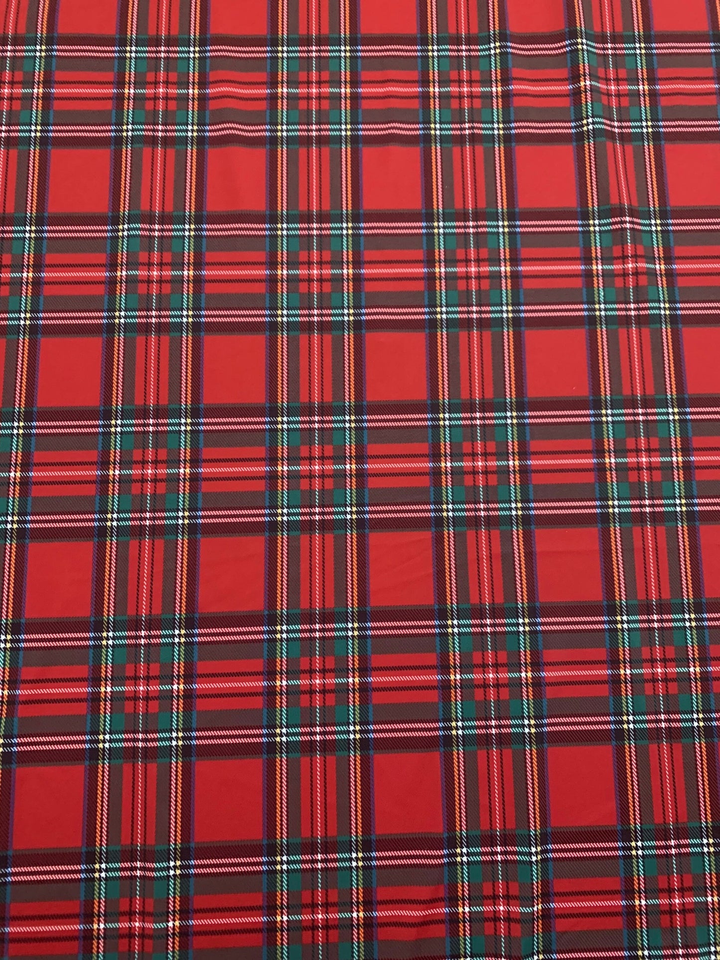 Red & green tartan plaid design print on nylon spandex 4-way stretch 58/60”sold by the YD. ships worldwide from  Los Angeles California USA.