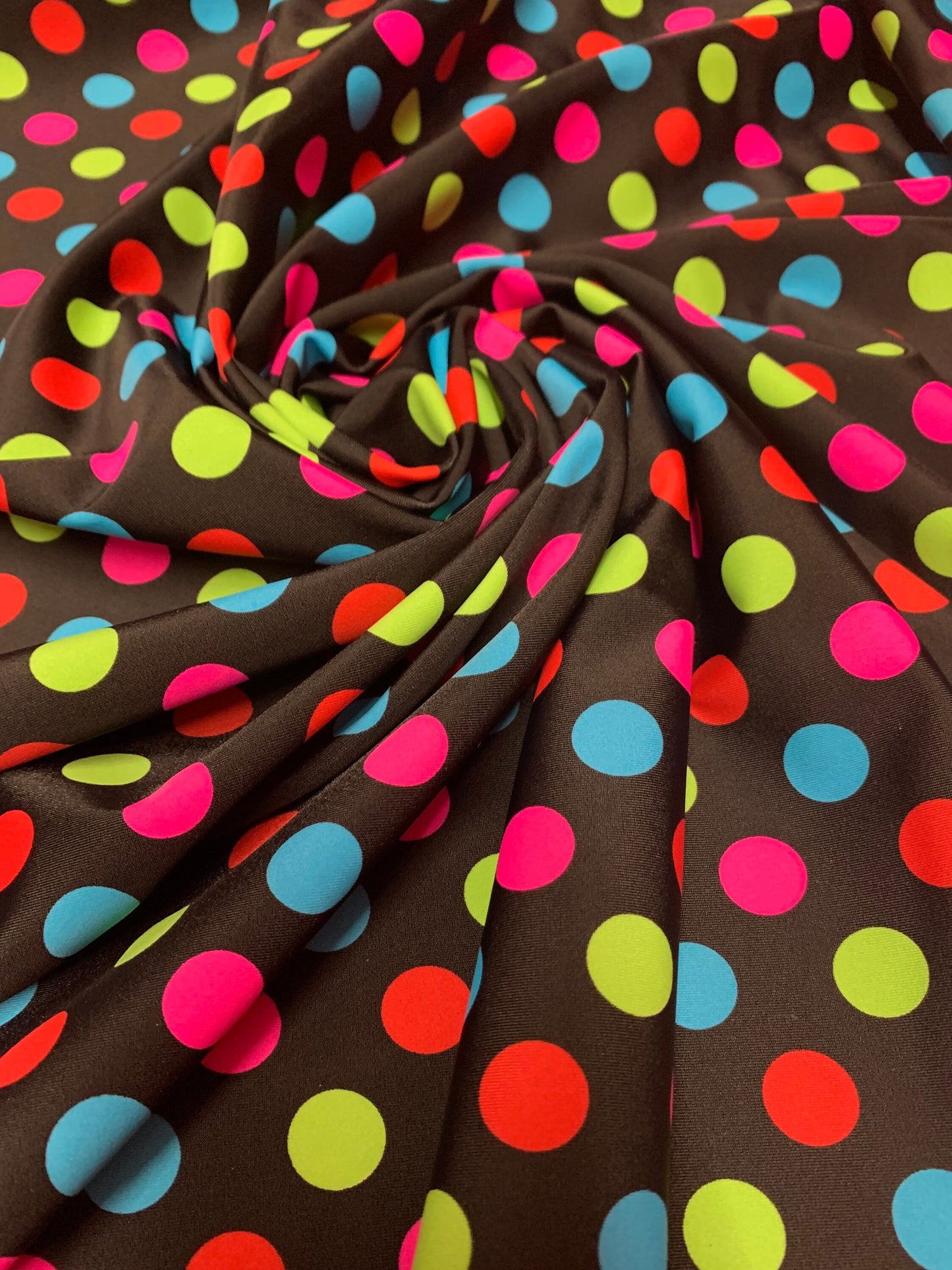 Colorful polka dot design print on the best quality of nylon spandex 4-stretch 58/60”sold by the YD.Ships worldwide from Los Angeles CA USA.