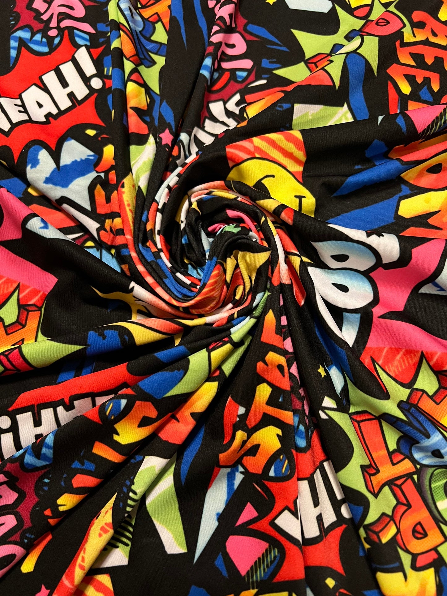 Fashion graffiti design print on the best quality of nylon spandex 4-way stretch 58/60”sold by the YD.ships worldwide from Los Angeles CA