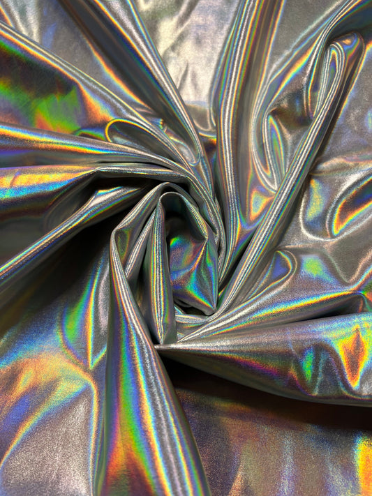 New iridescent/silver all over foil nylon spandex 4-way stretch 58/60”sold by the YD. Ships worldwide from Los Angeles California USA.