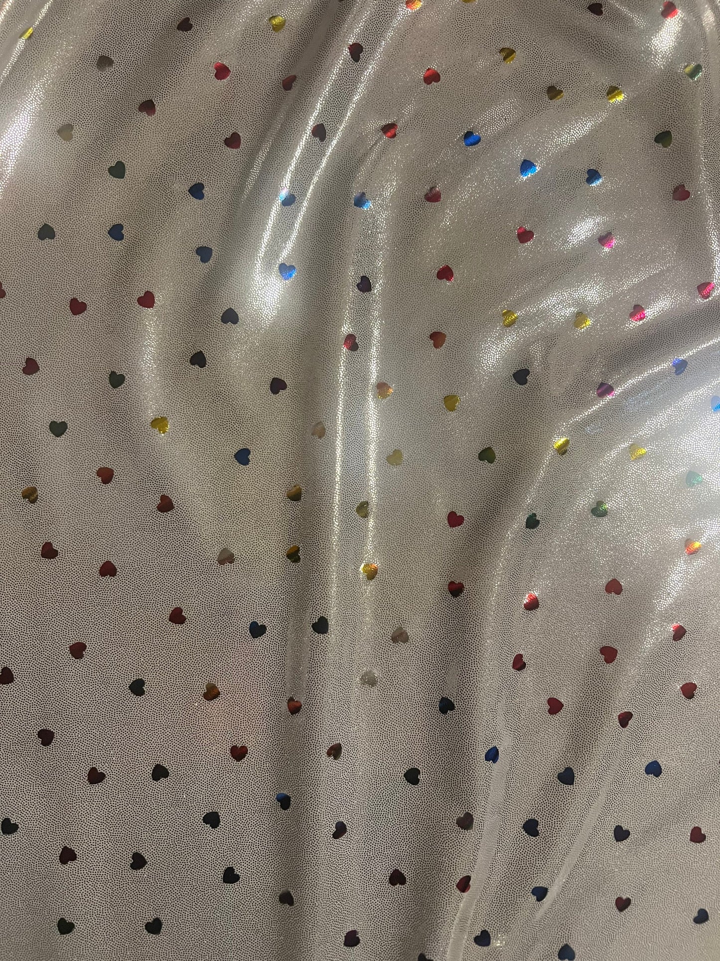 New little hearts hologram design new metallic hologram nylon spandex 4-way stretch 58/60”sold by the YD.Ships worldwide from Los Angeles CA