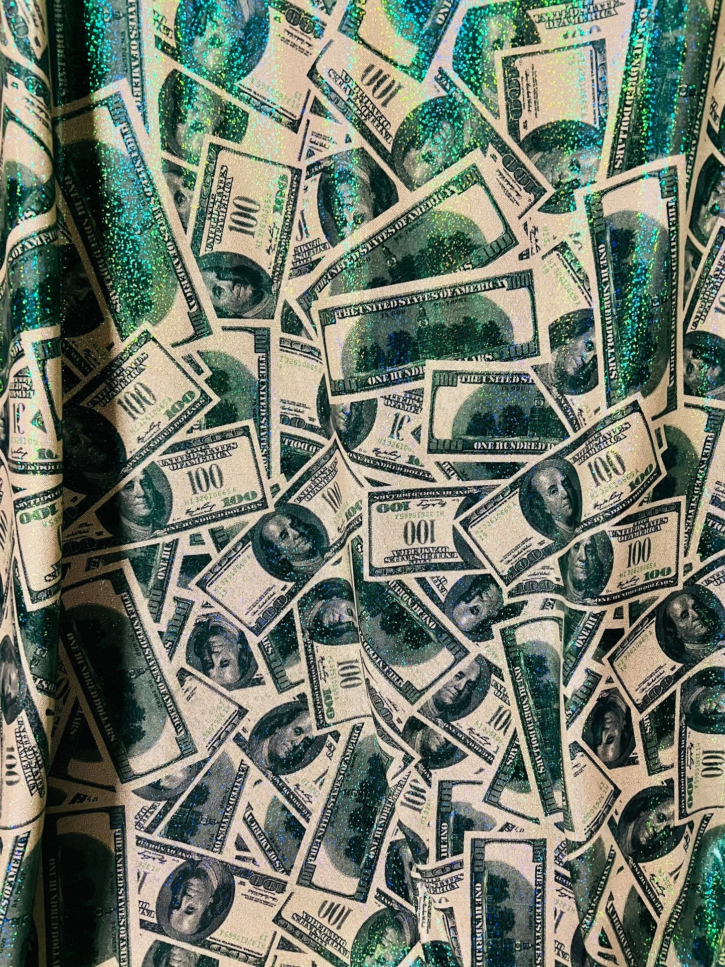 Money design with green foil 4-way nylon spandex sold by the yard